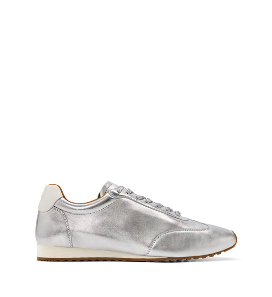 Silver sneaker with white sole on a white background