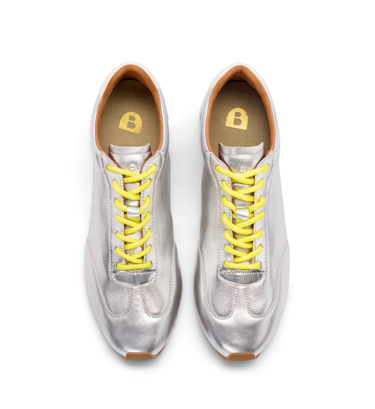 Silver sneakers with yellow laces on a white background