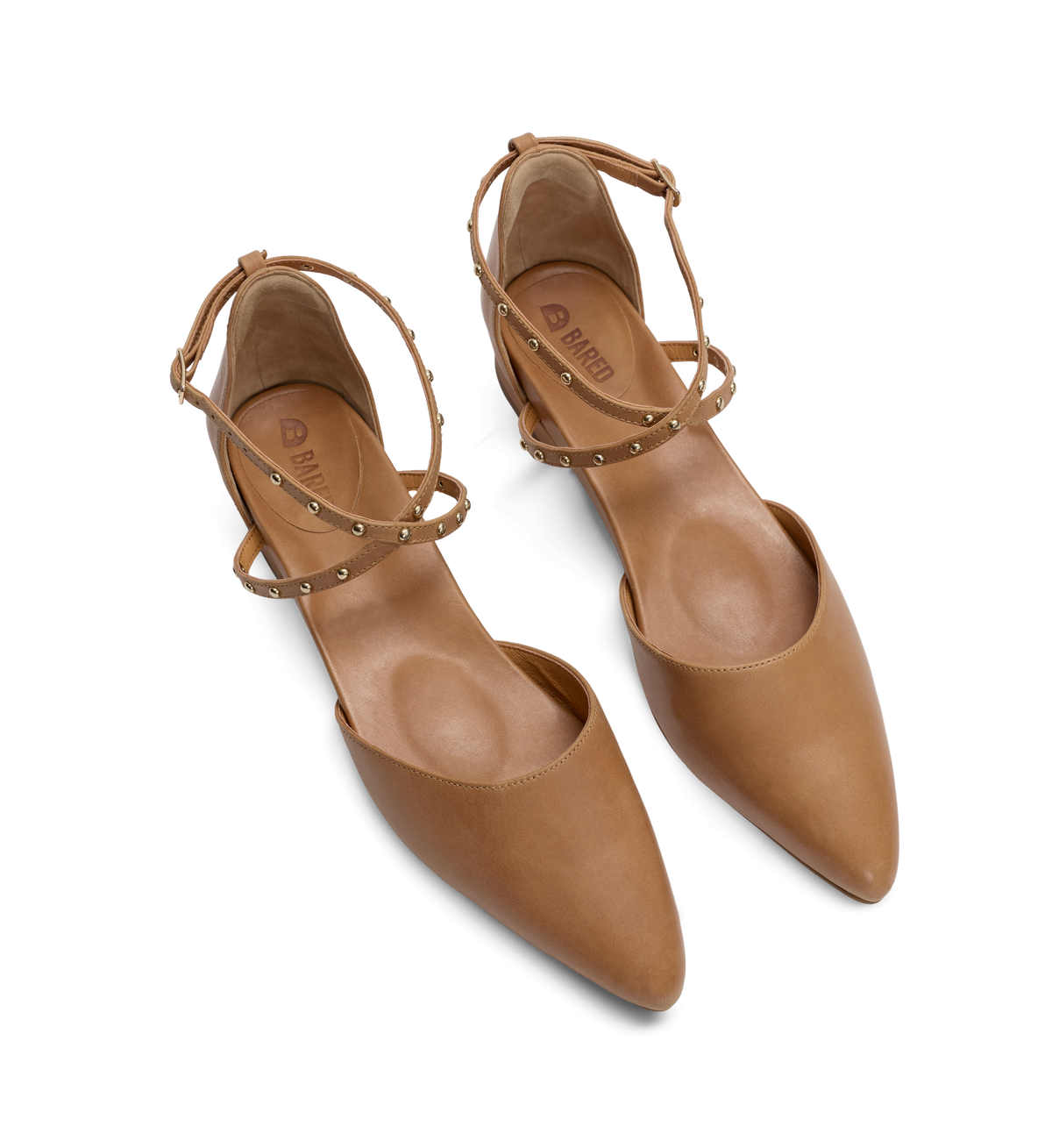 Pair of tan pointed-toe flats with studded details on a white background