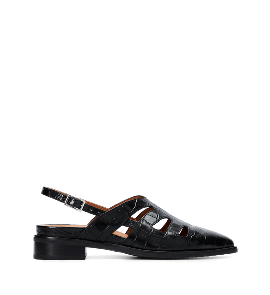 Black flats with a strap on a white background
