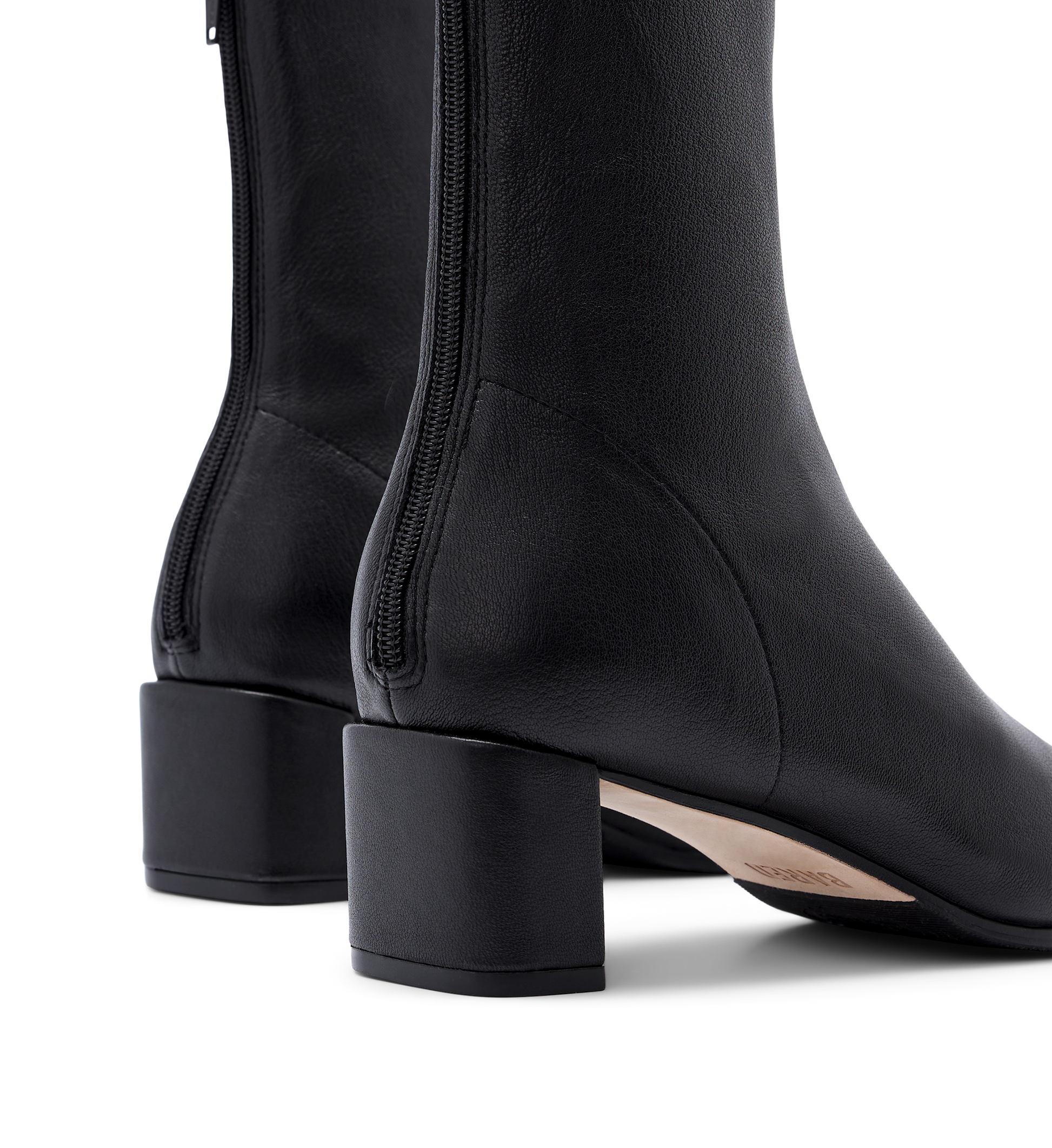 close up on the heel of the bared footwear hylia black sock boot with zip detail