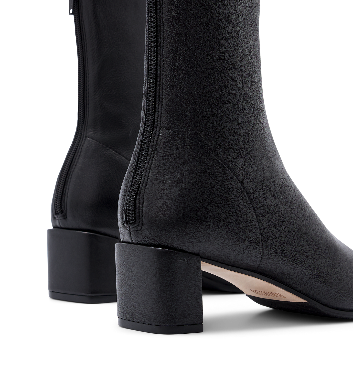 close up on the heel of the bared footwear hylia black sock boot with zip detail