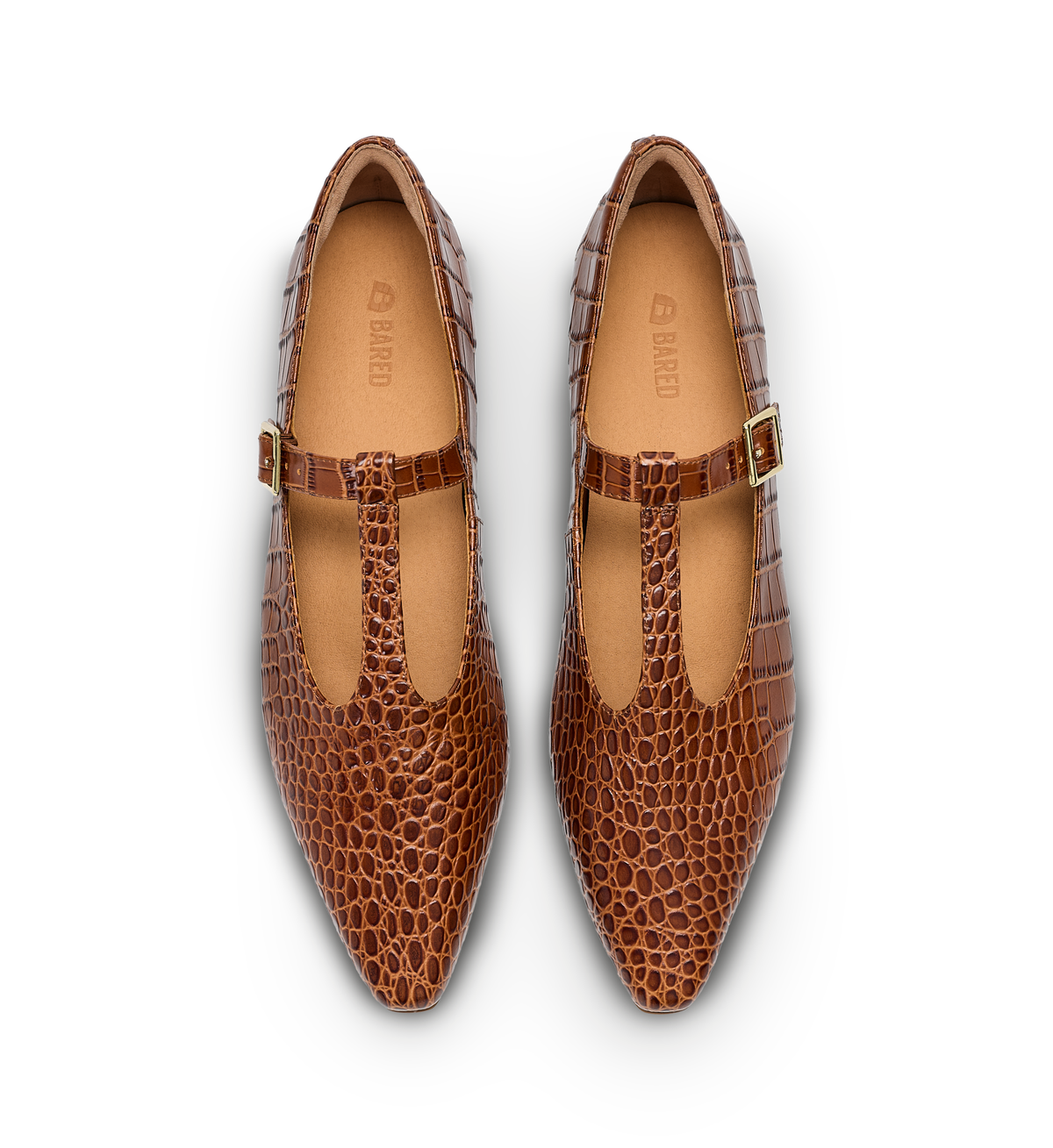 Pair of brown pointed-toe shoes with a patterned design on a white background