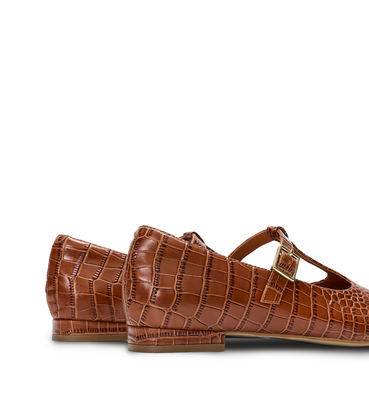 Brown crocodile-patterned shoes with a buckle on a white background