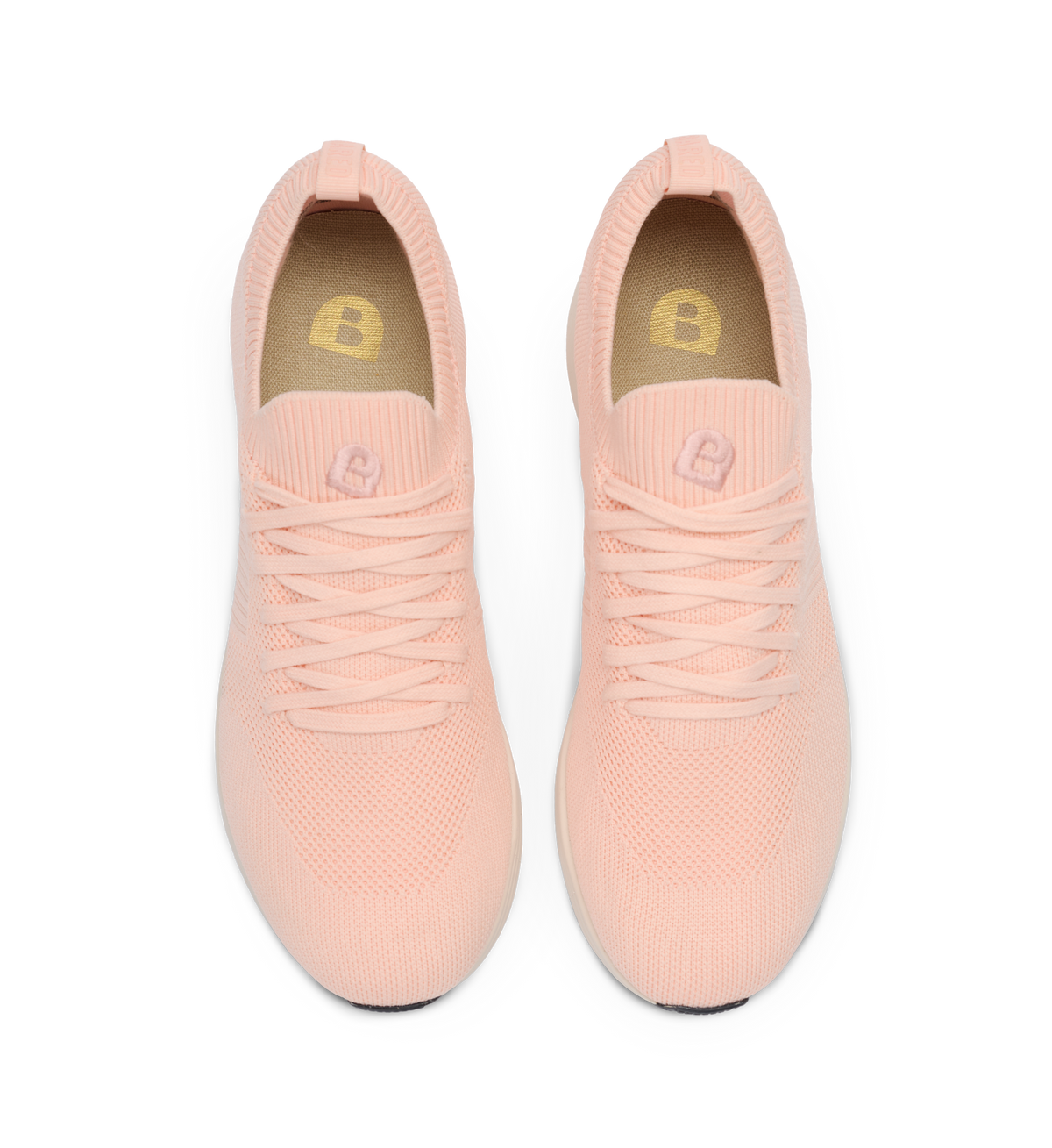 Pair of pink sneakers on a white background