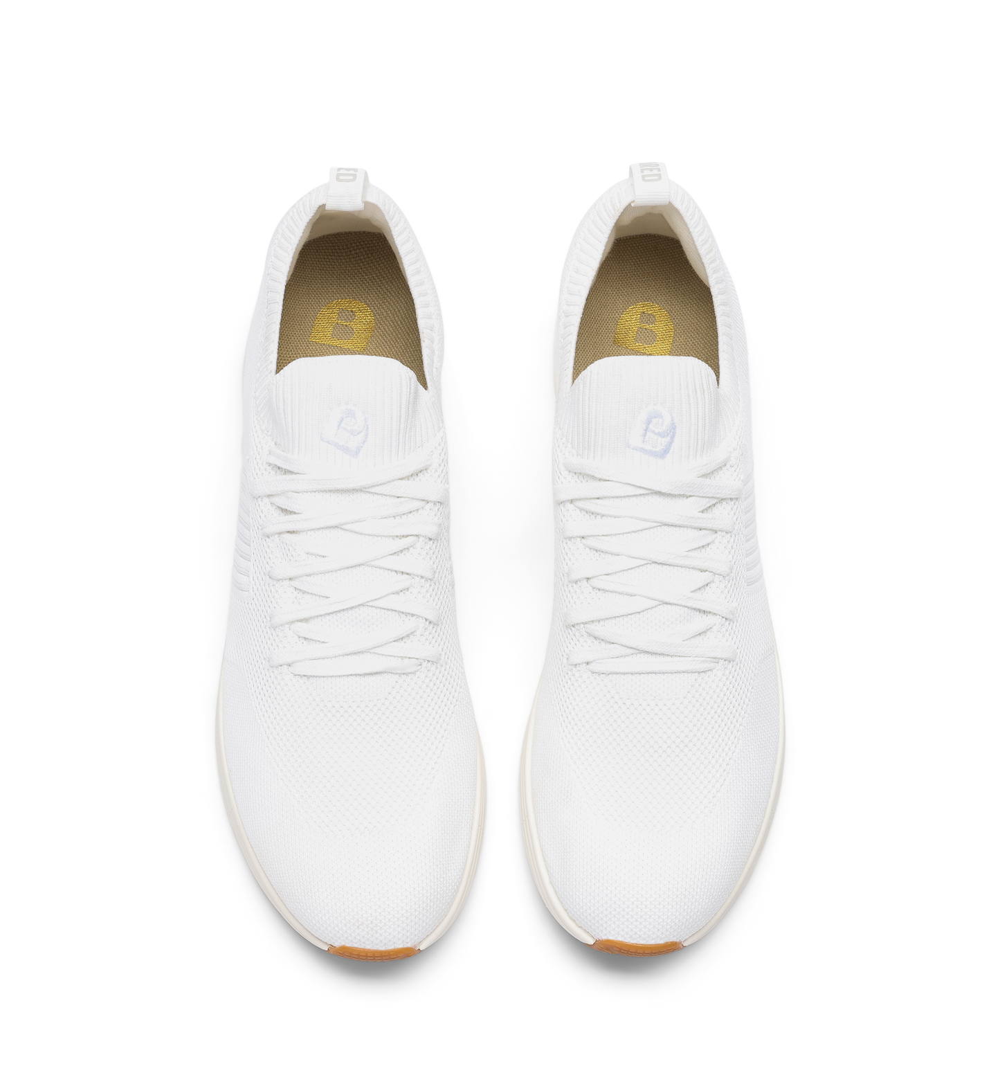 pair of womens white sneakers in knit