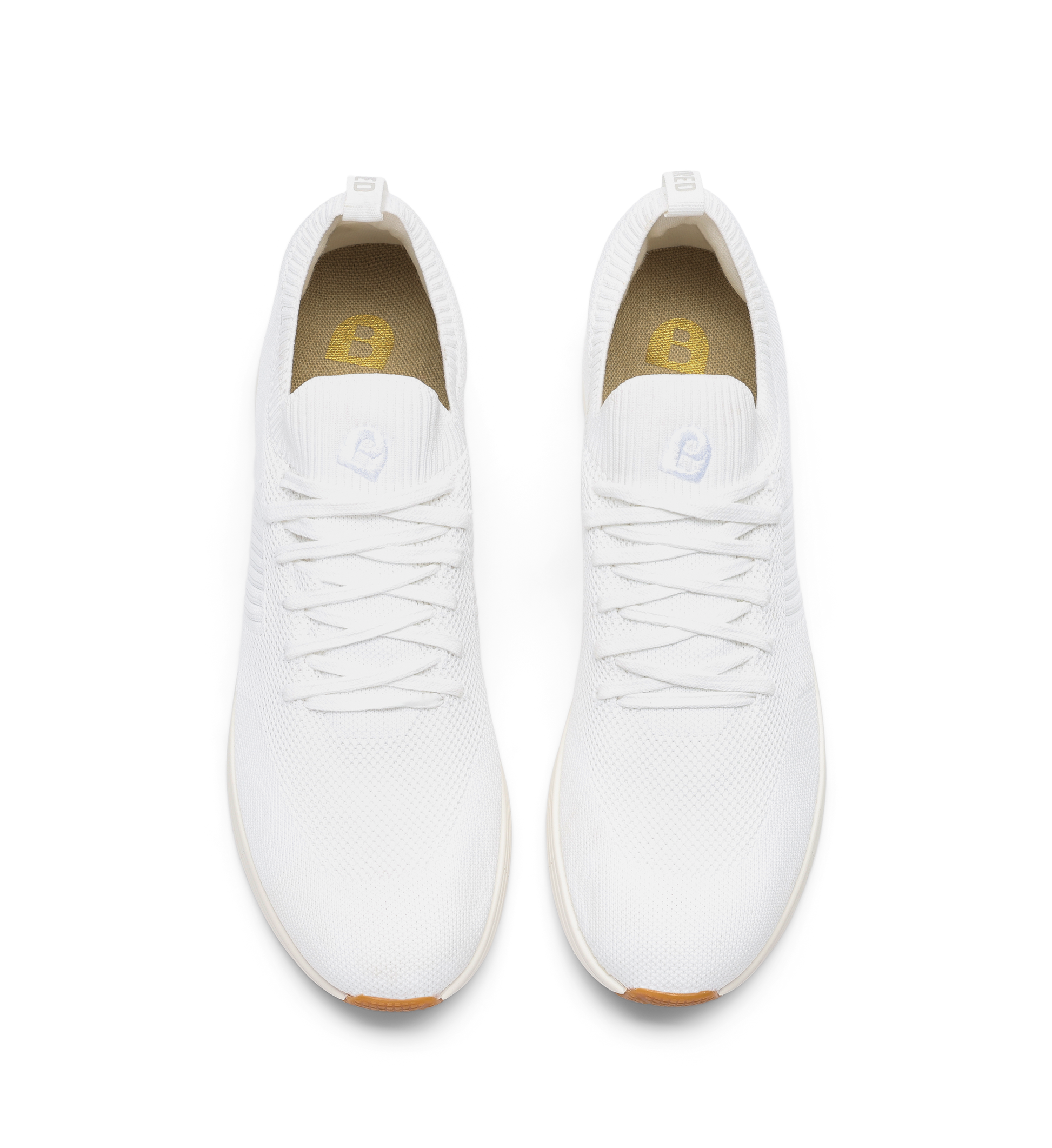 pair of womens white sneakers in knit