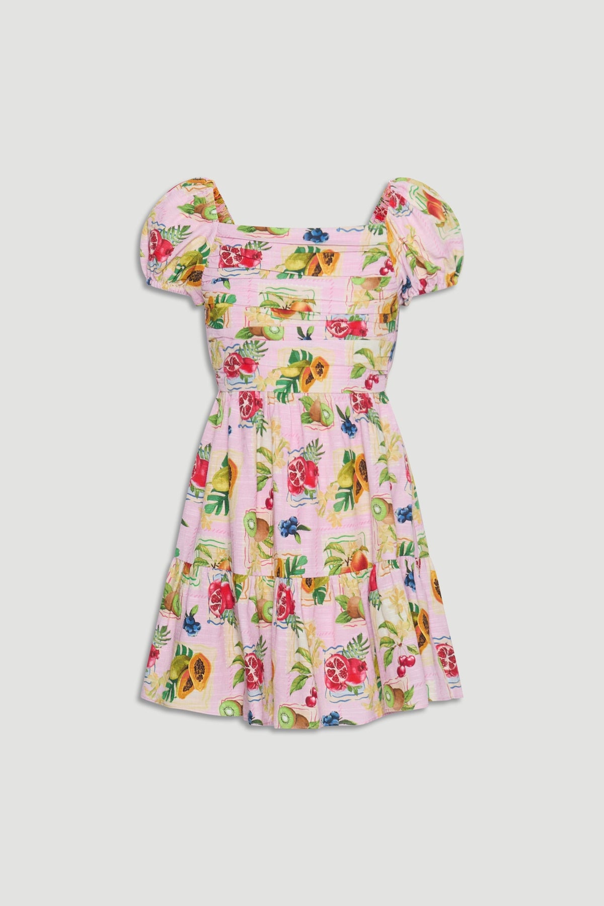 Girls mini dress featuring puff sleeves and a vibrant fruit print on a soft pink background for playful style