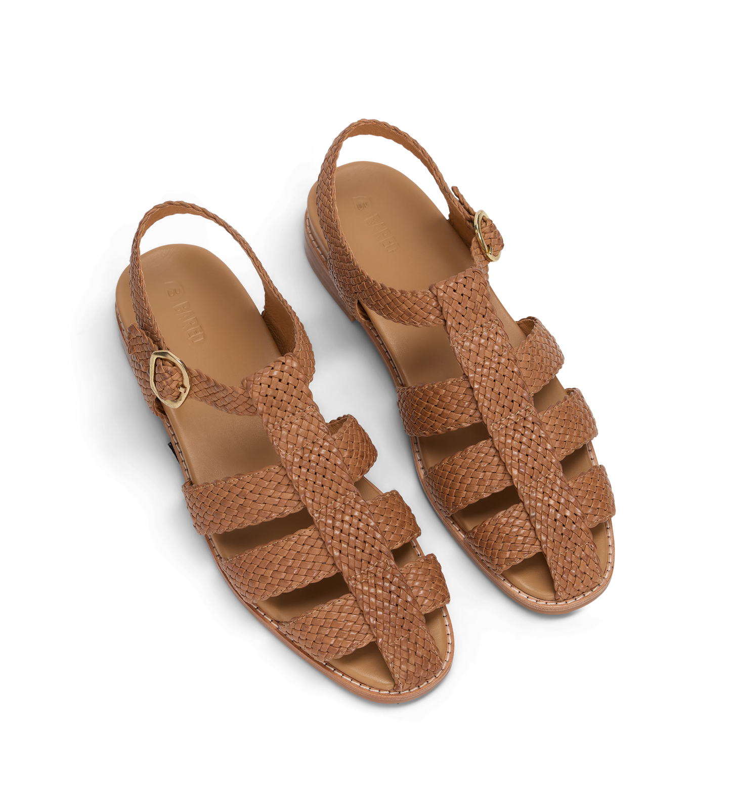Pair of brown woven sandals on a white background