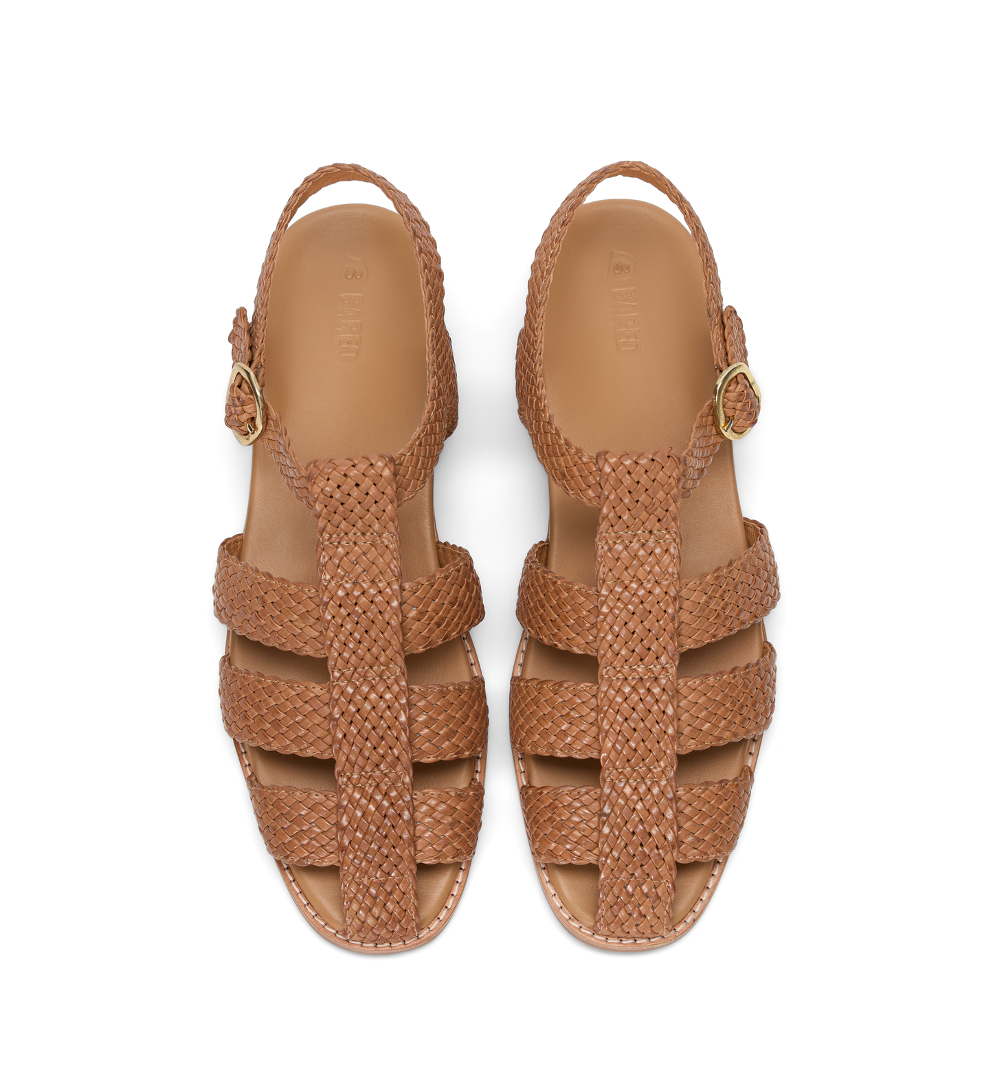 Pair of brown woven sandals on a white background
