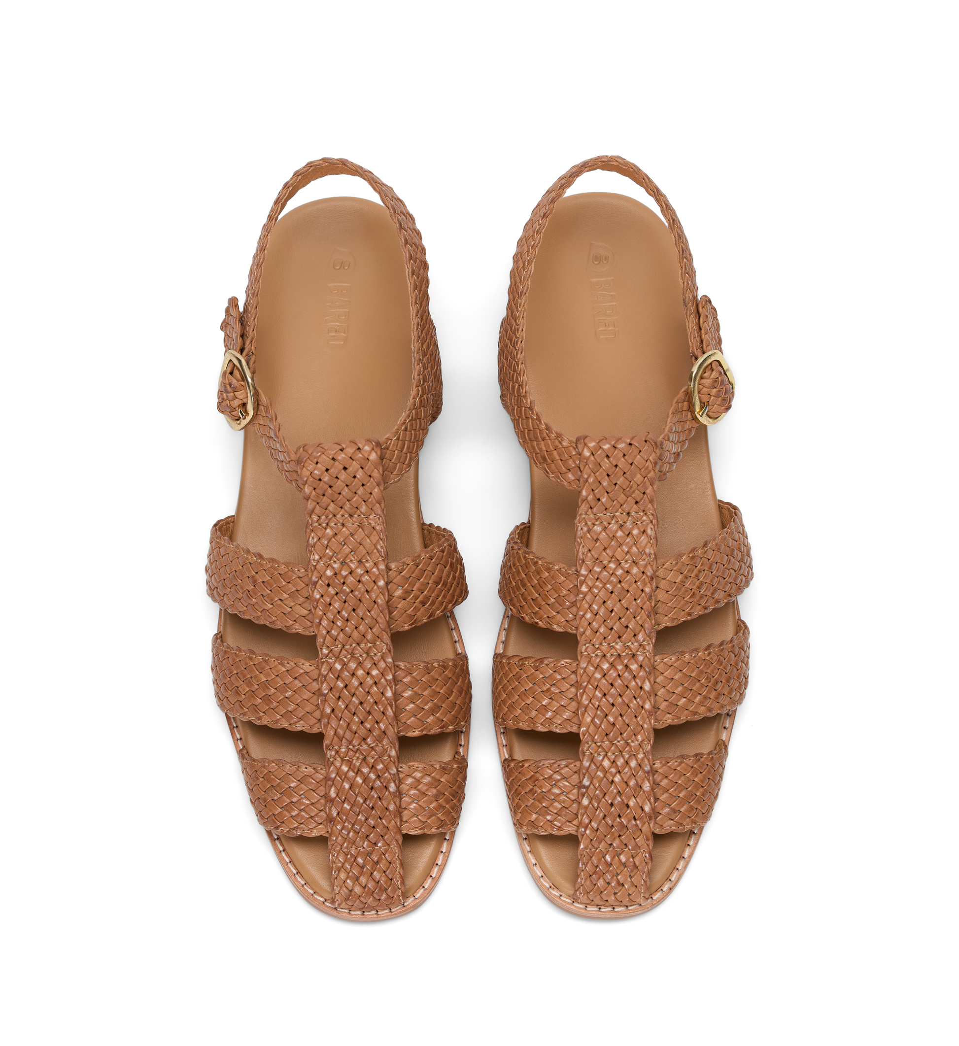 Pair of brown woven sandals on a white background