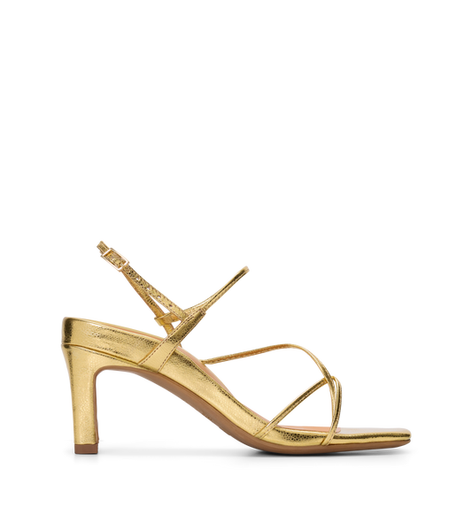 Gold high-heels on a white background