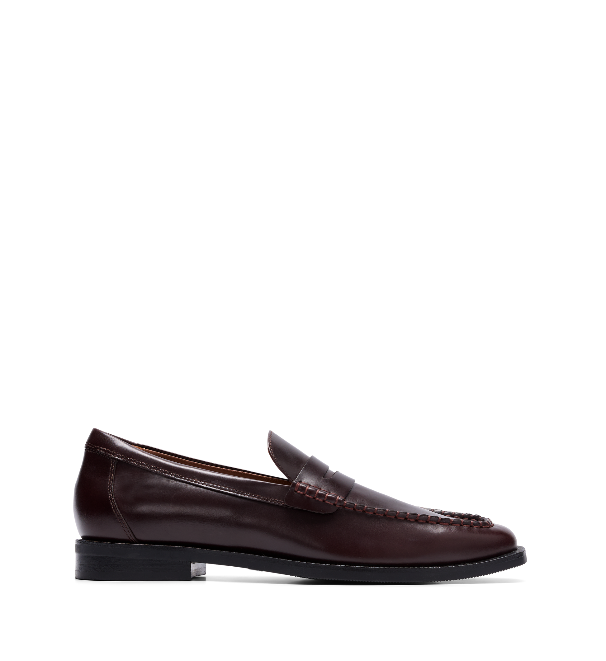 A mahogany brown boxed leather loafer with handstitched detailing and a classic penny strap.