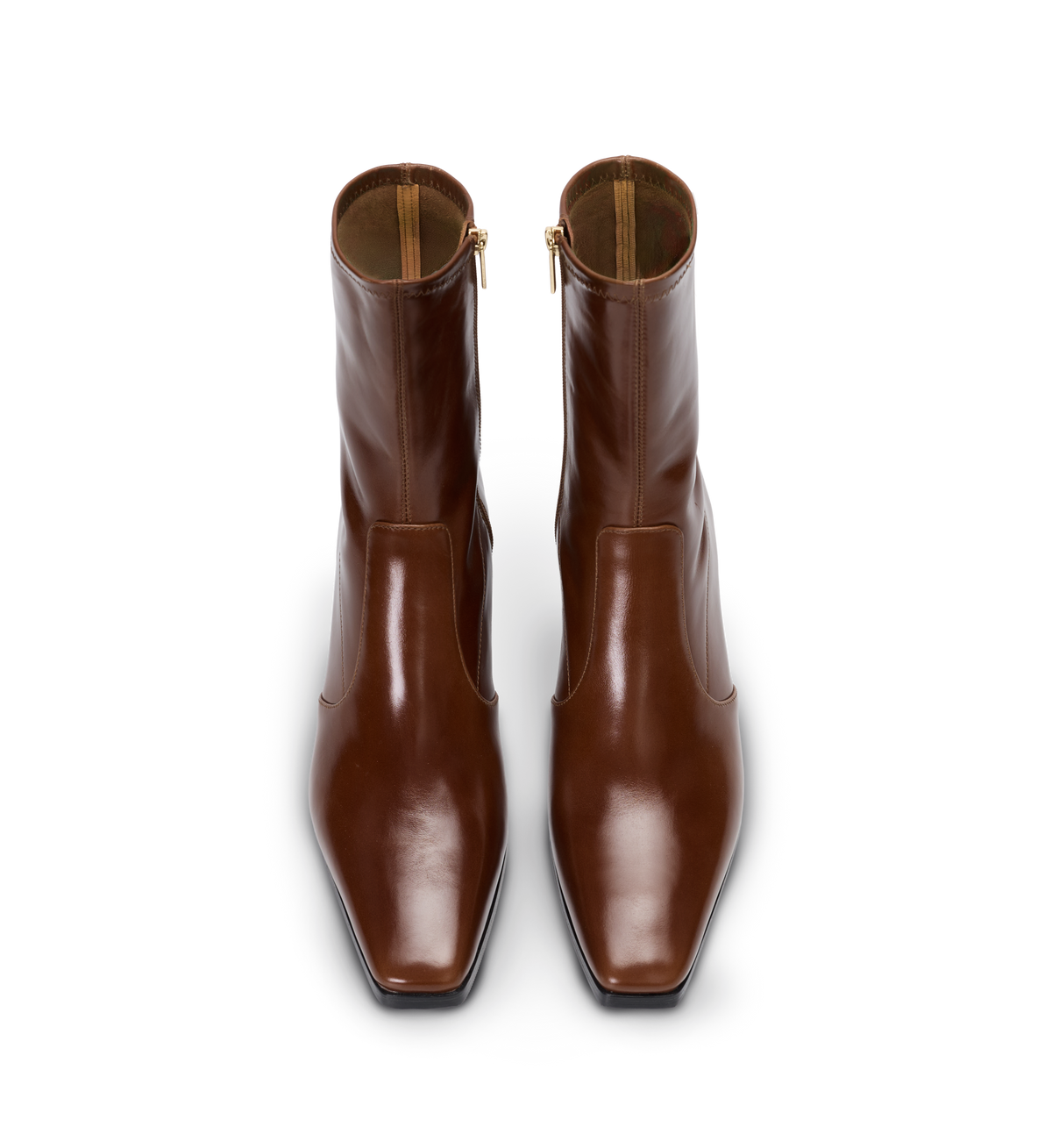 Pair of tan leather boots on a white background