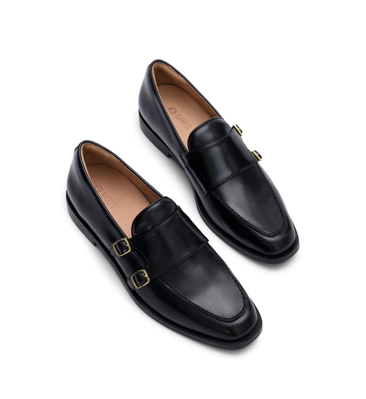 pair of women black leather loafers with gold buckles