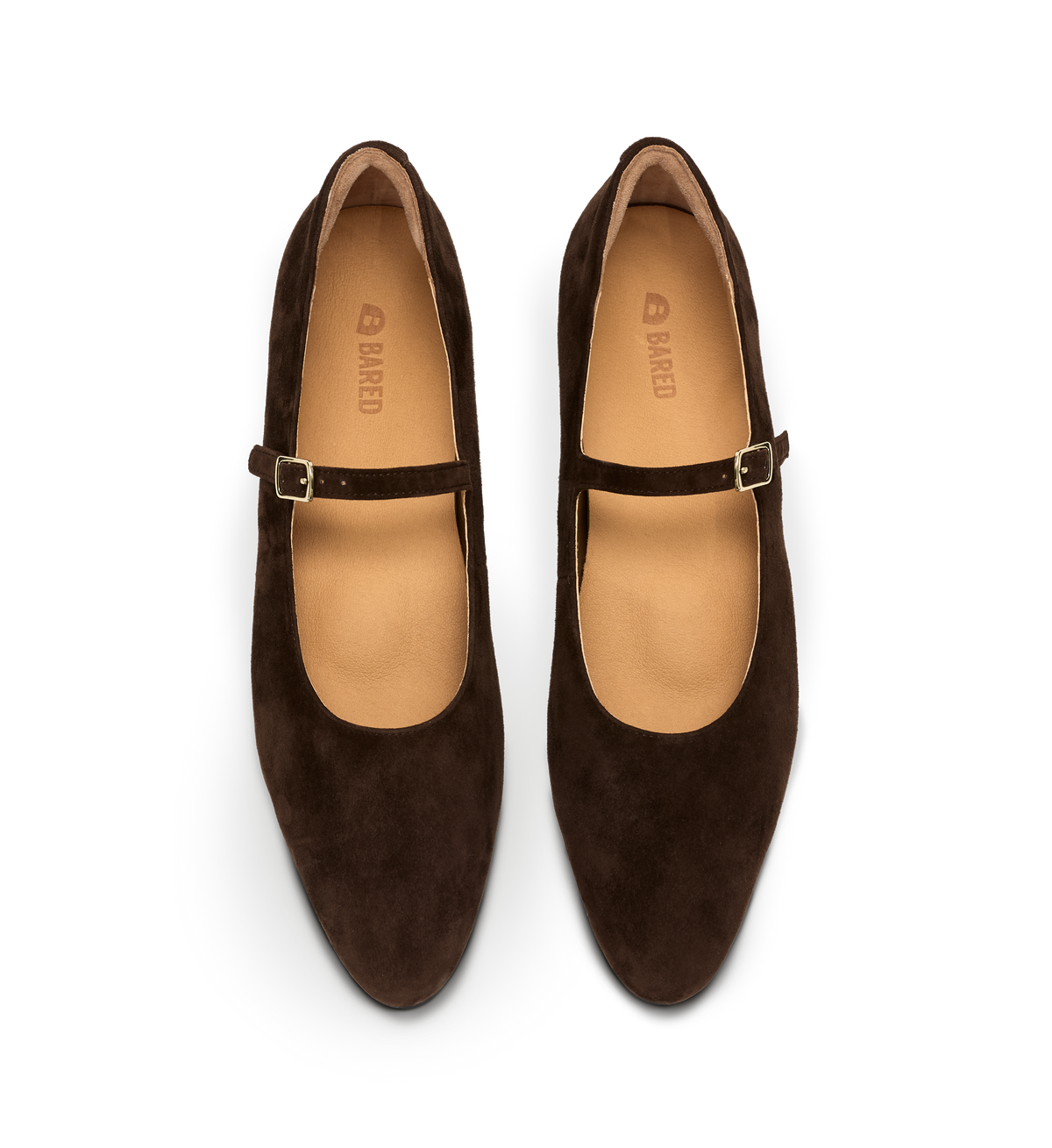 Pair of brown suede shoes with a strap on a white background