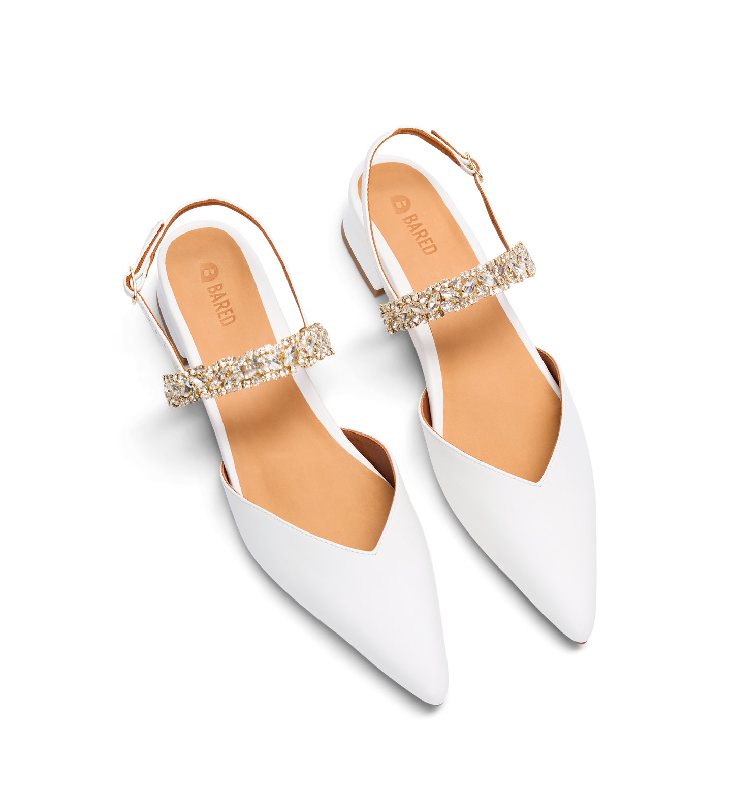 White pointed-toe shoes with gold embellishments on a white background