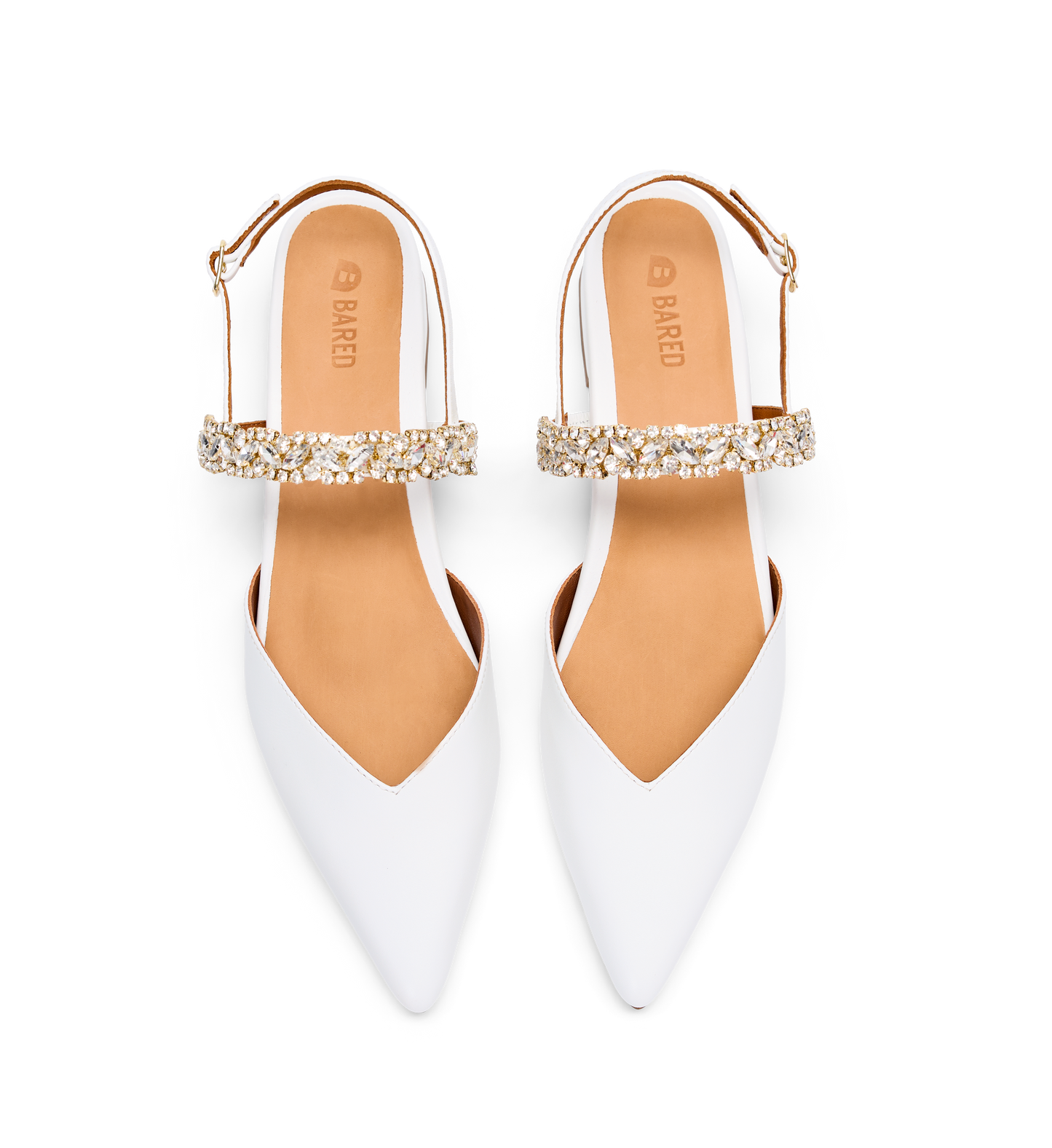 White pointed-toe shoes with gold embellishments on a white background