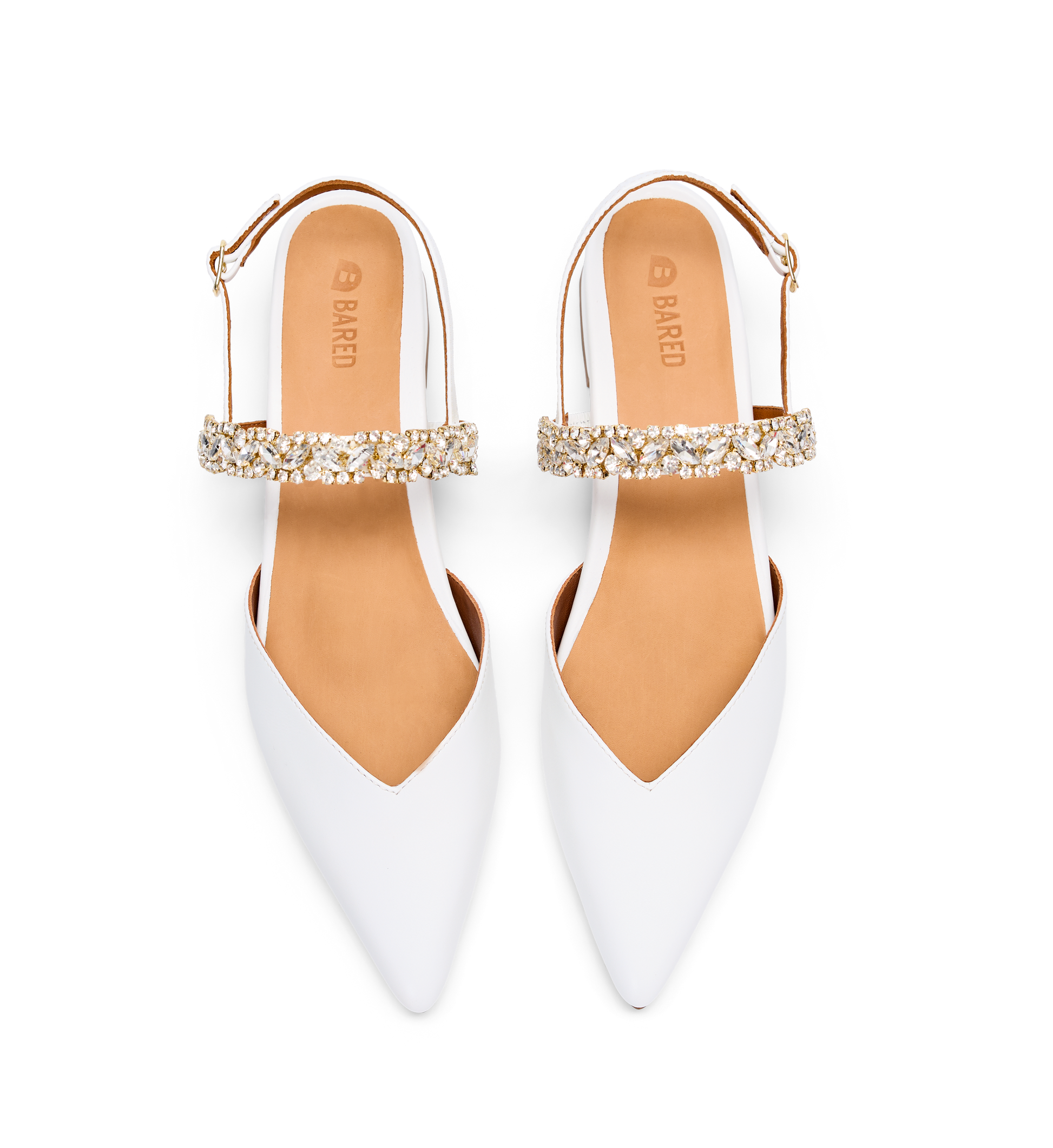 White pointed-toe shoes with gold embellishments on a white background