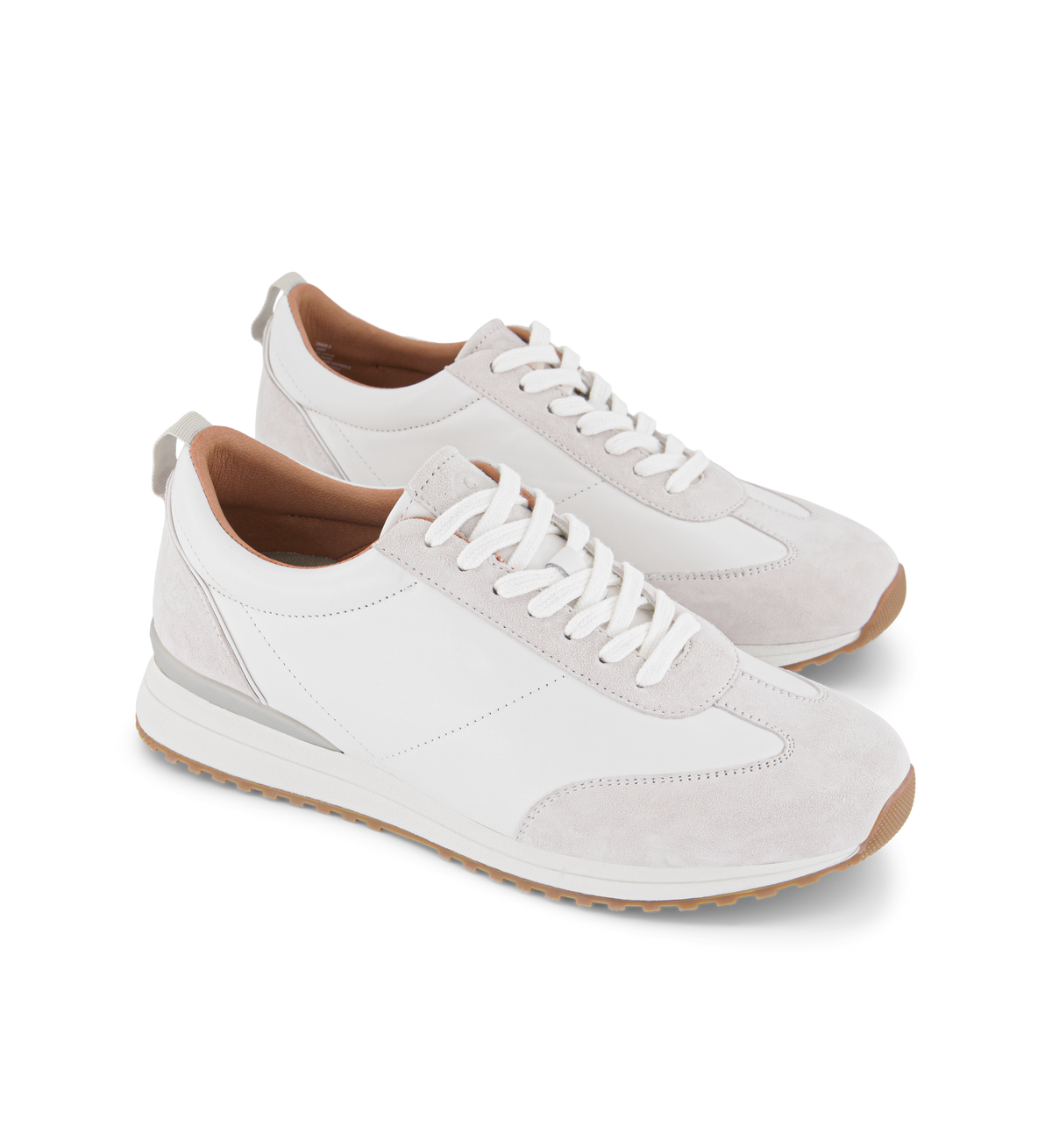 pair of womens white sneakers and white laces