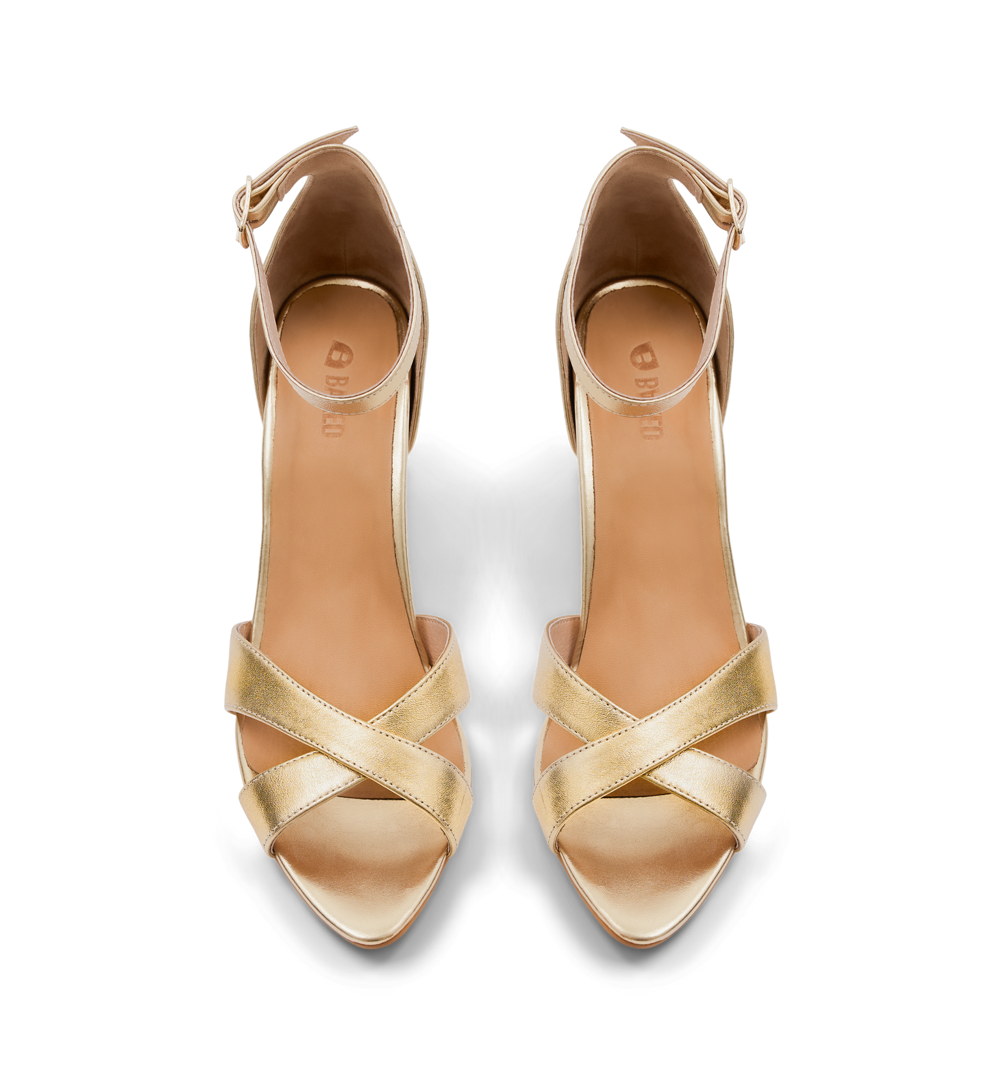 Gold high-heels on a white background