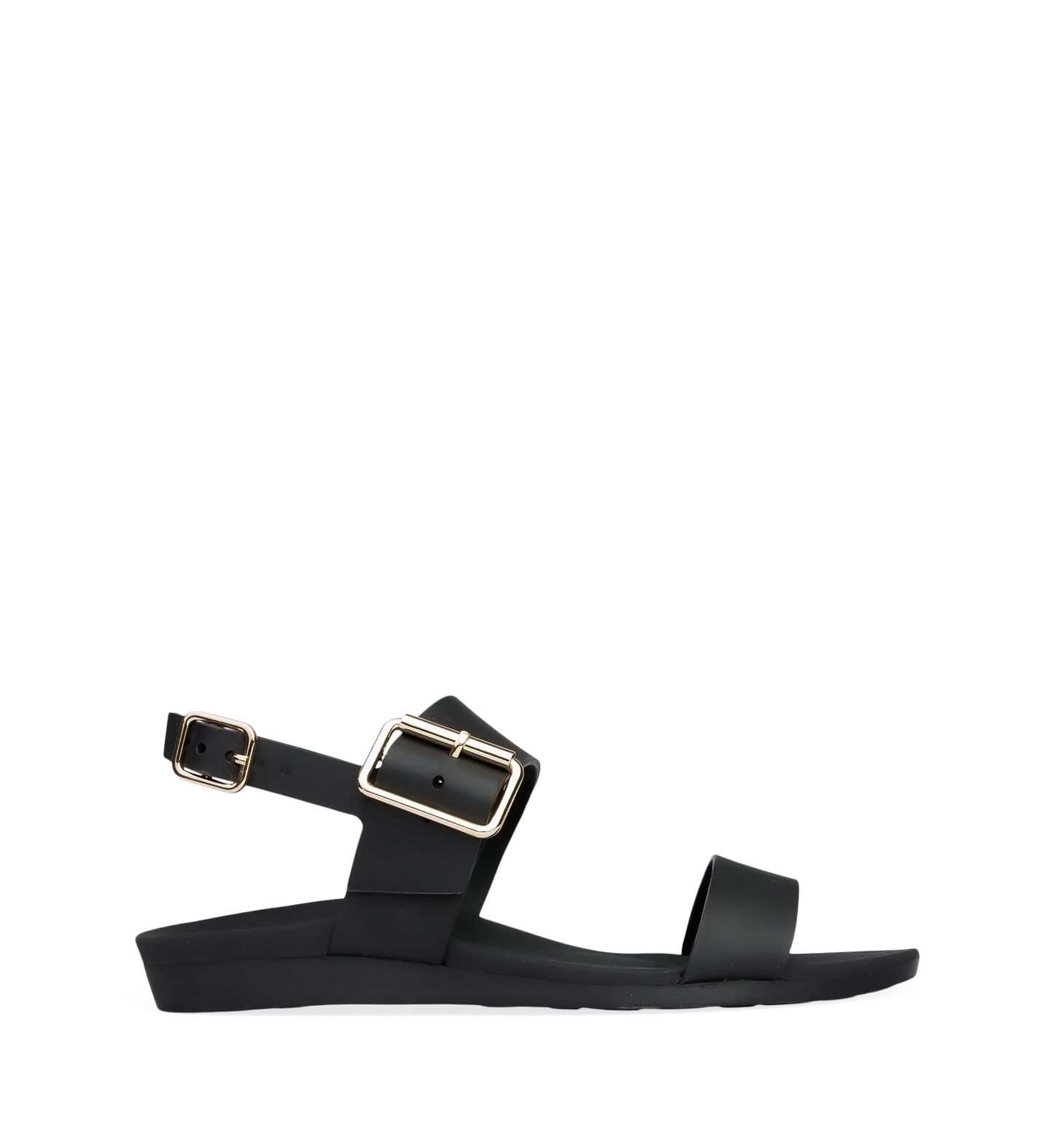 A black flat sandal with buckle straps and a contoured footbed, featuring gold hardware.