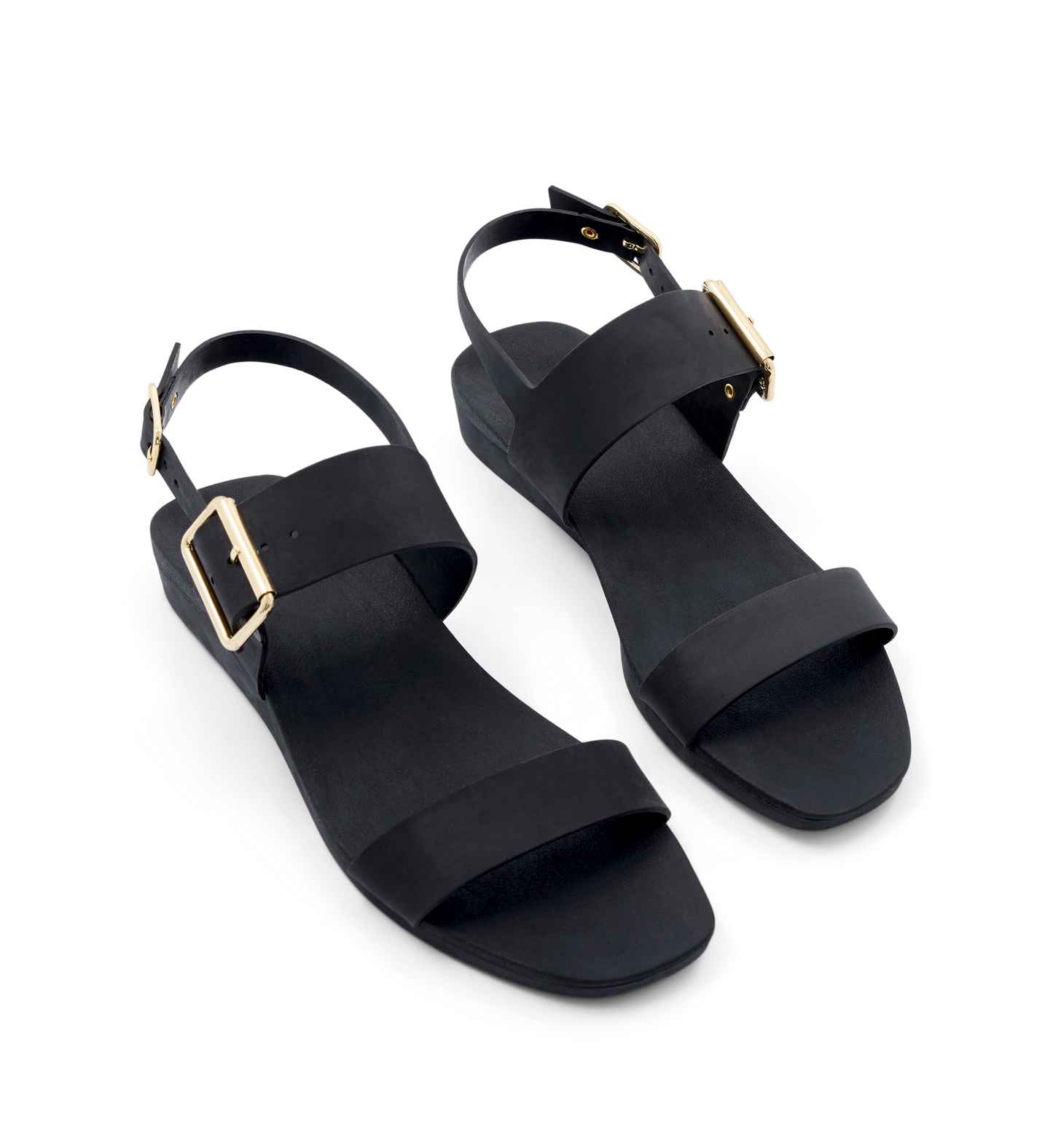 Black sandals with gold buckles on a white background