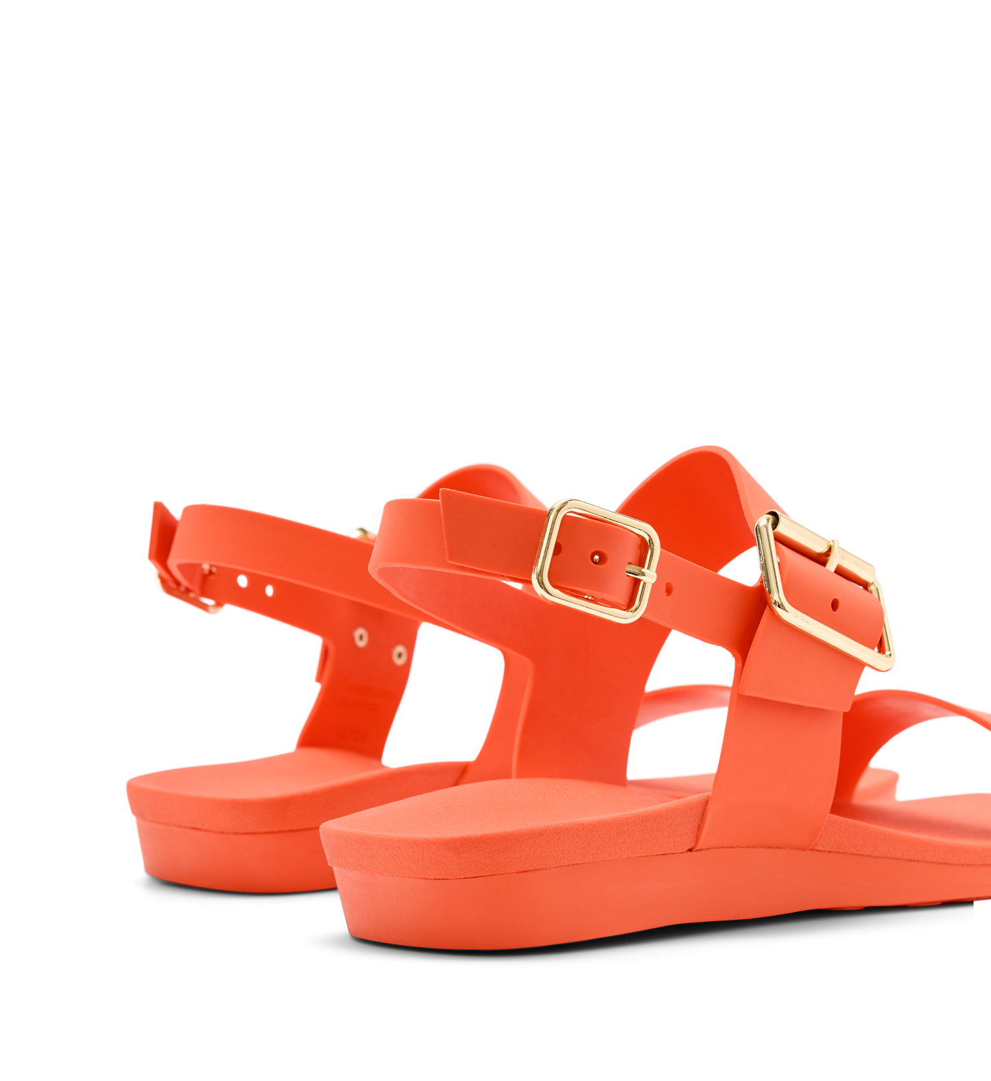 bright orange rubber sandals with gold buckles