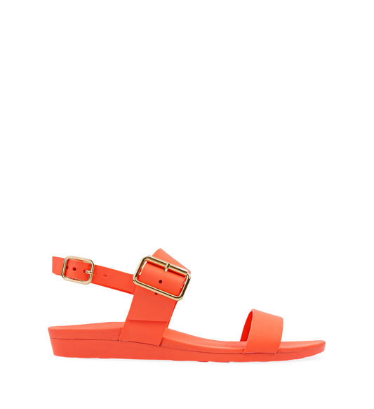 A pair of flat sandals in orange with buckle straps and a contoured footbed.