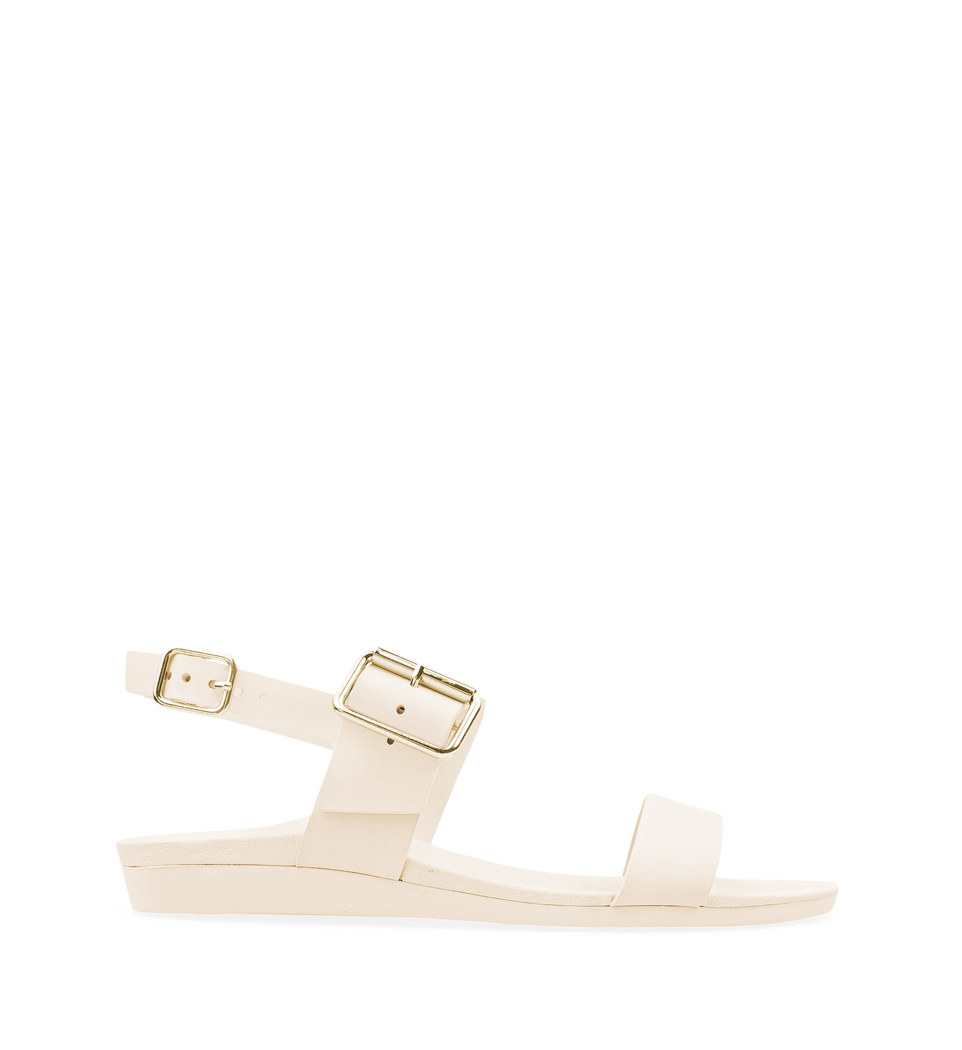 A flat sandal with white straps and a gold buckle, featuring a contoured footbed.