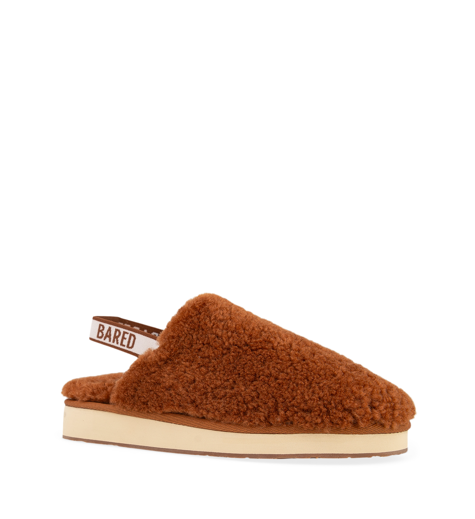 a terracotta hued sheepskin slingback slipper with the bared logo