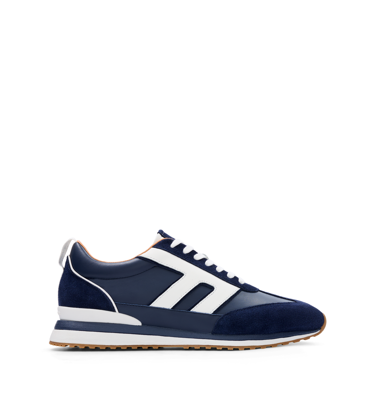 A navy leather and suede sneaker with white detailing and a rubber outsole.