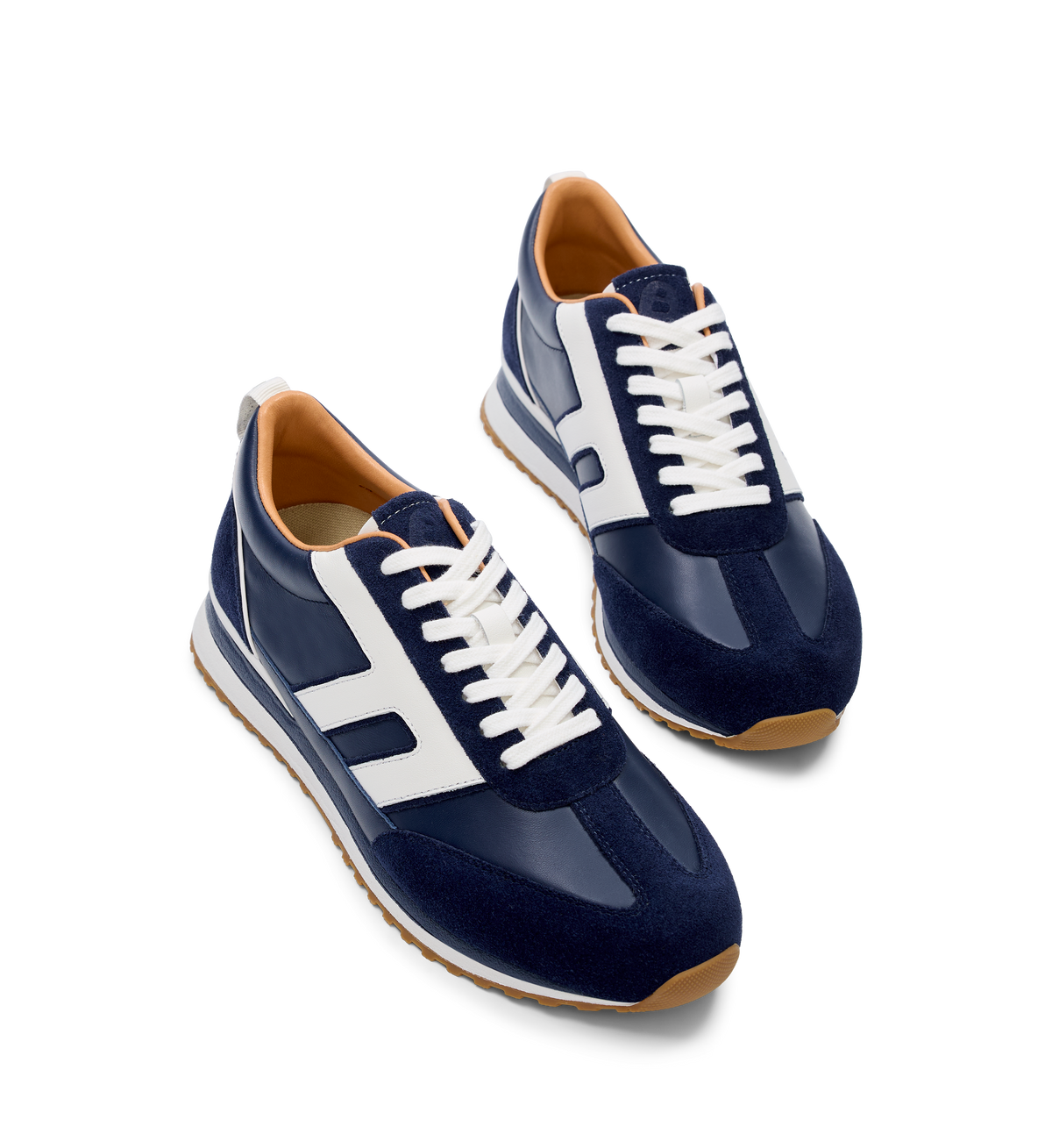 pair of womens navy sneakers with white accents and laces