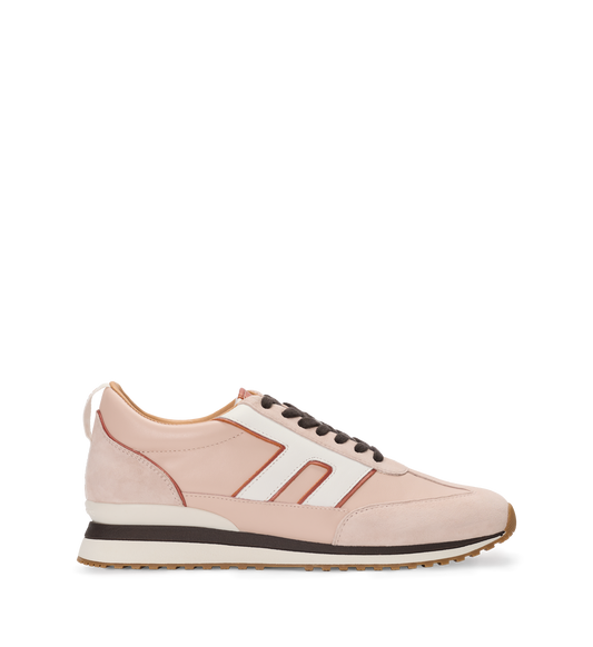 Pink sneaker with white stripes on a white background
