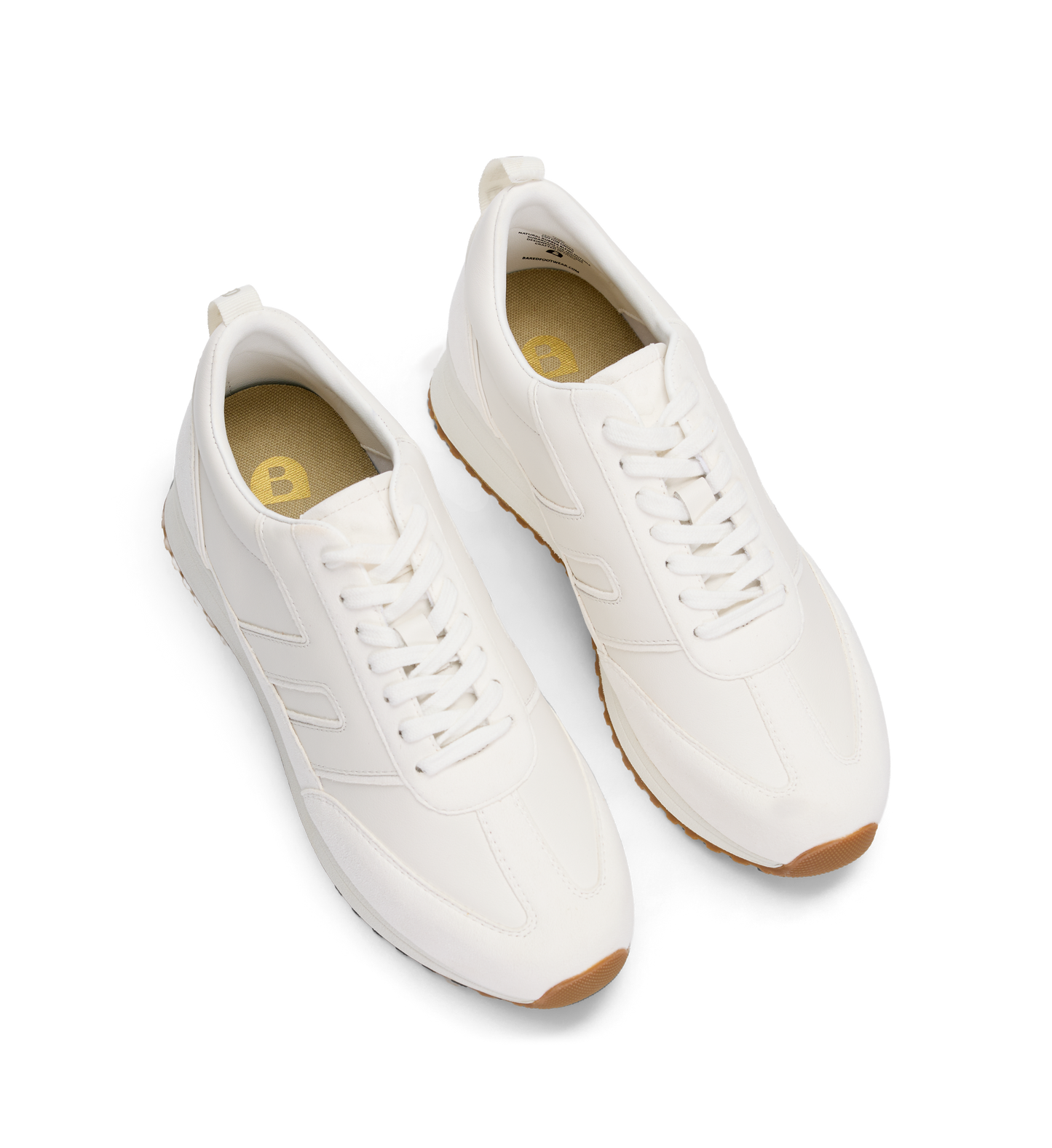 Pair of white sneakers with brown soles on a white background