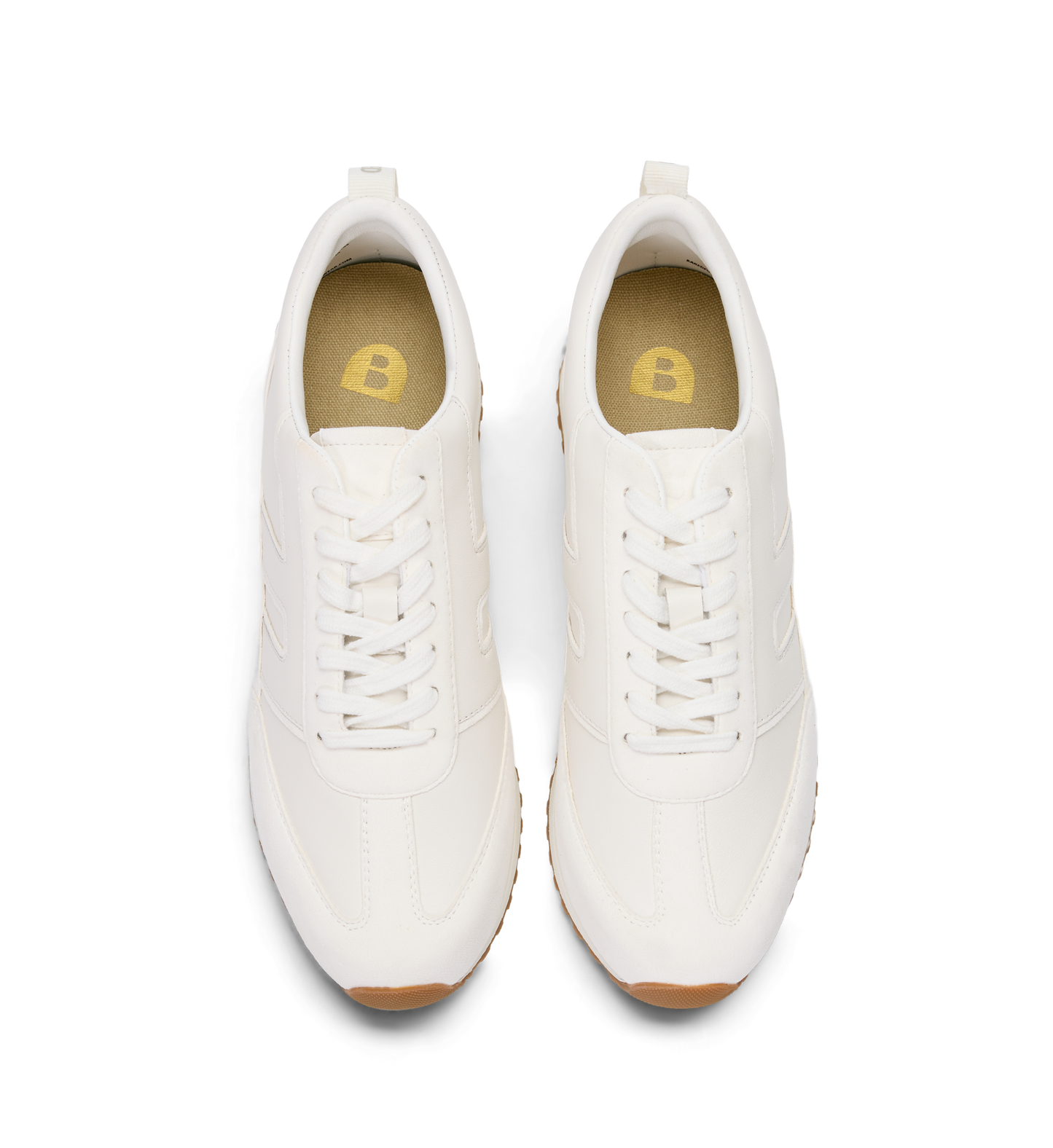 Pair of white sneakers with brown soles on a white background