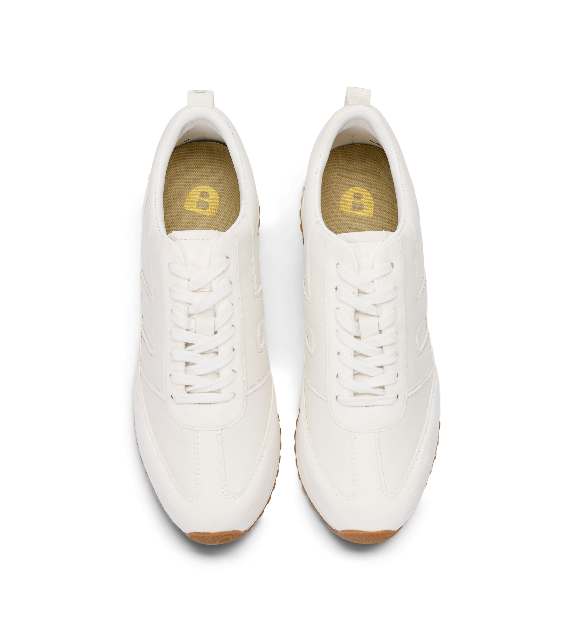 Pair of white sneakers with brown soles on a white background