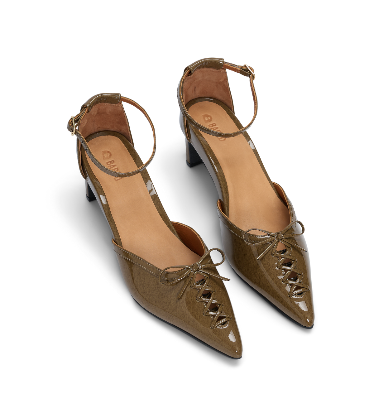 Pair of olive green patent leather high-heeled shoes with cut-out and lace up design on a white background