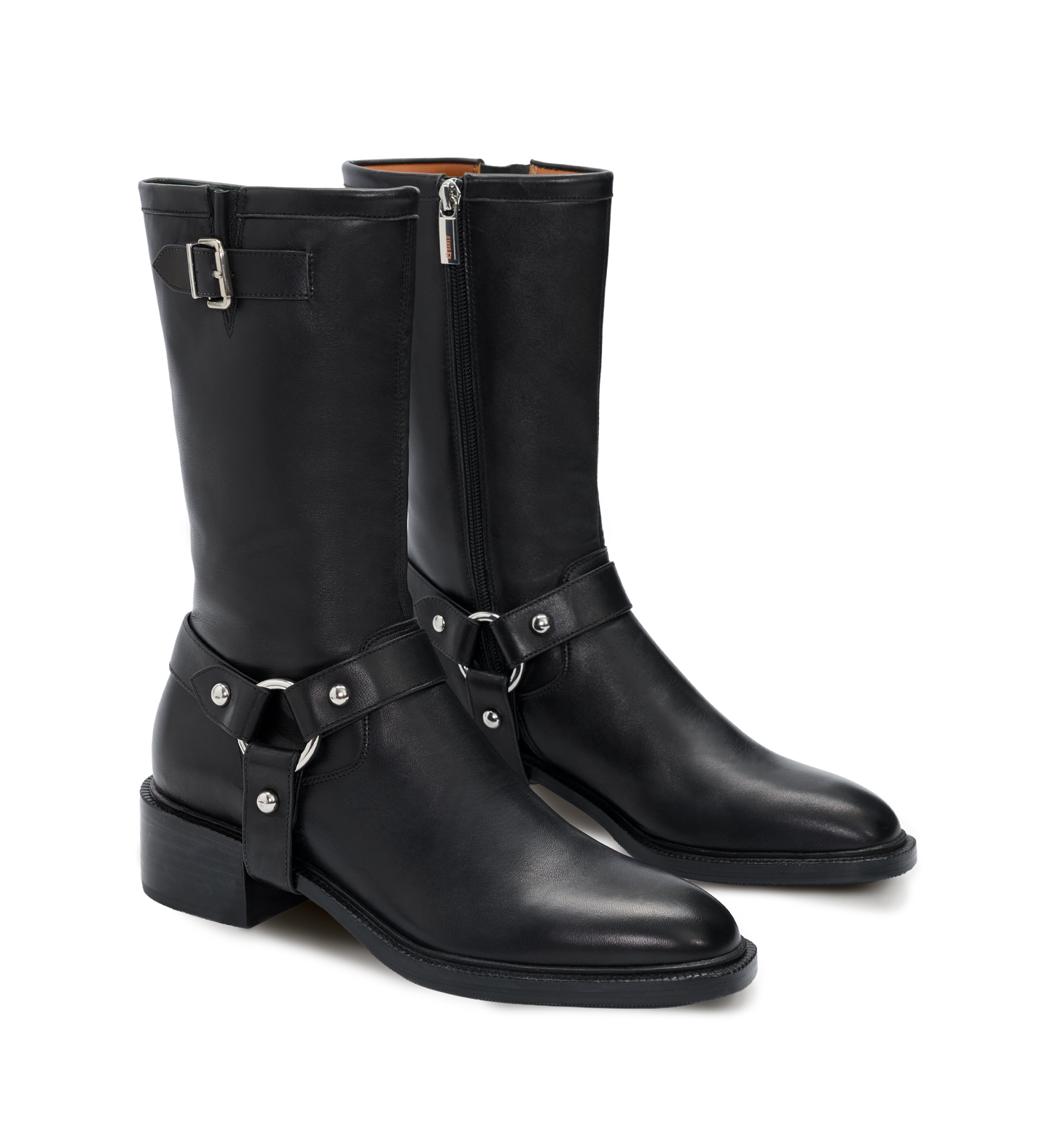 Pair of black leather boots with buckles on a white background