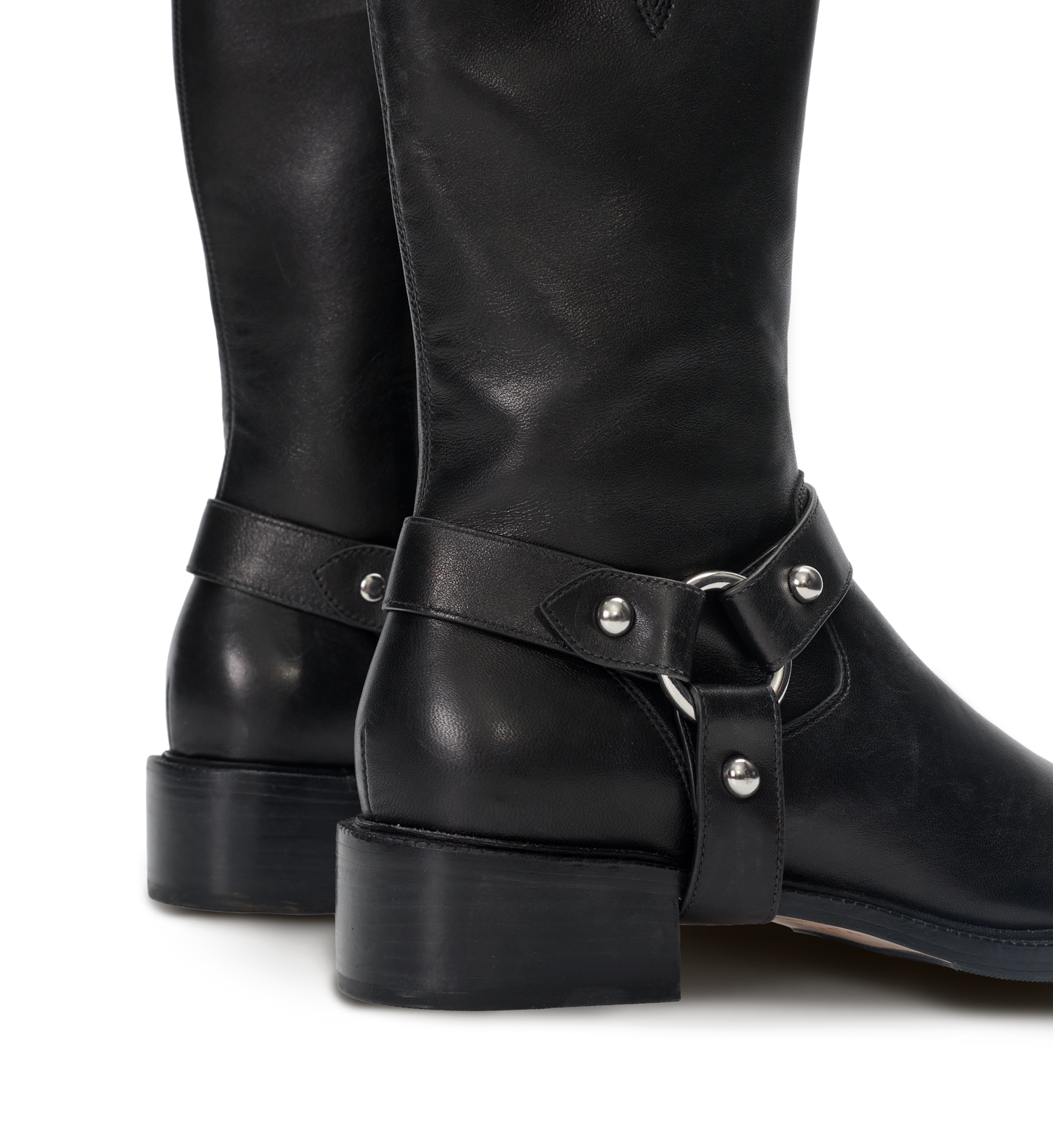Black leather boots with metal buckles on a white background