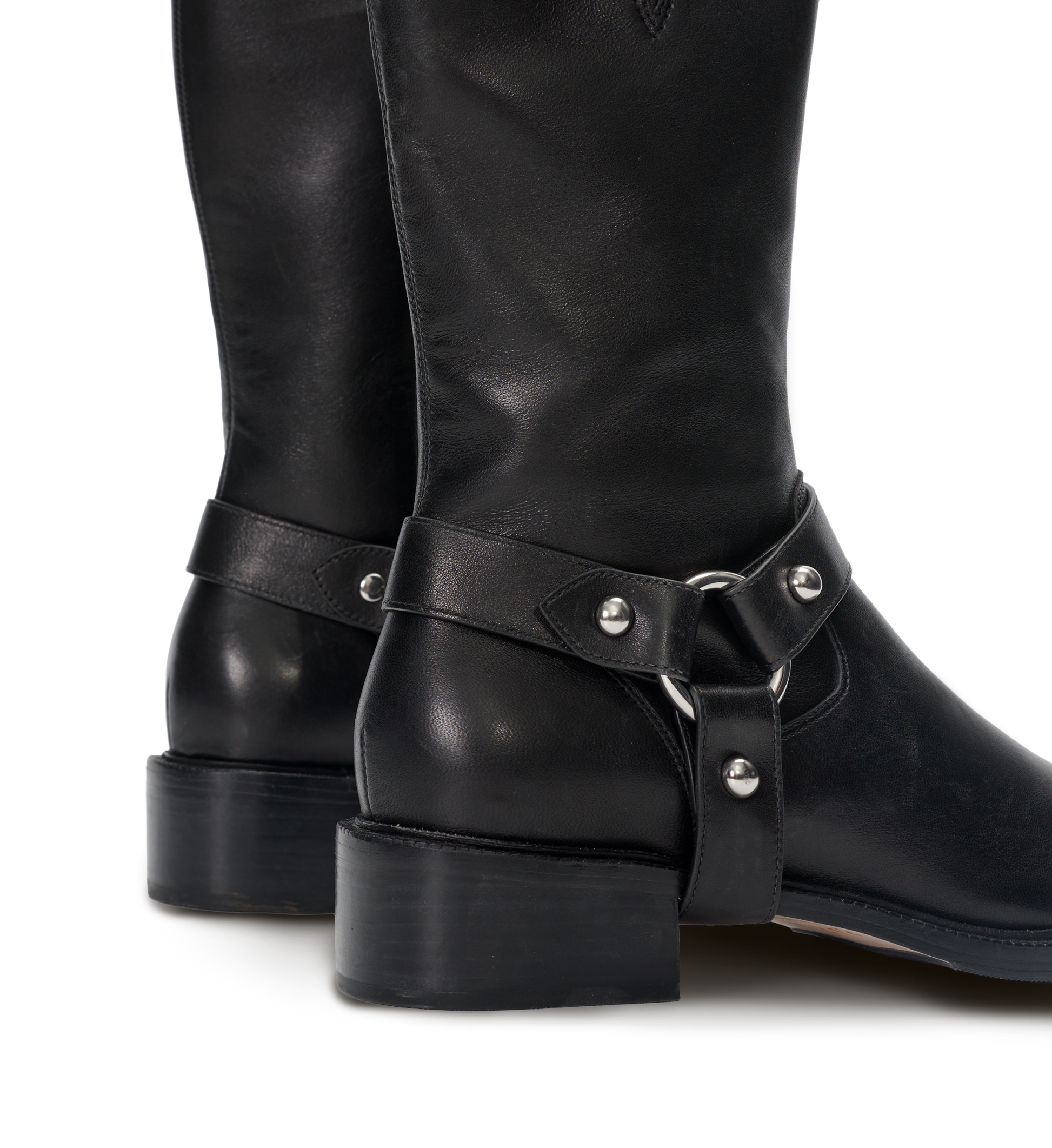 Black leather boots with metal buckles on a white background