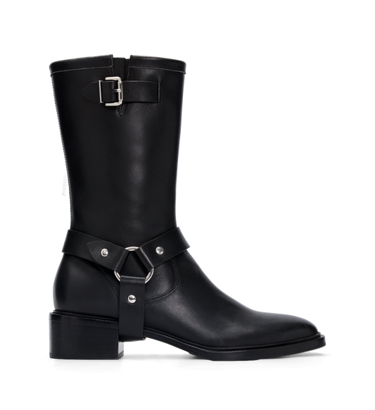 Black leather boot with silver buckles on a white background