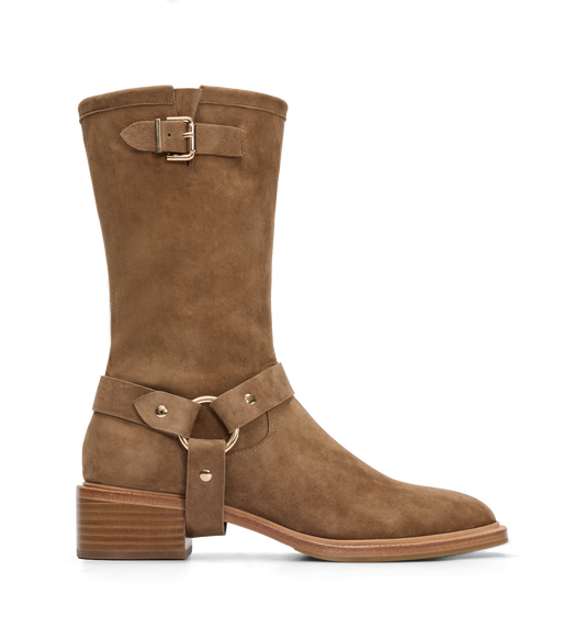 Brown suede biker boot with gold buckles on a white background