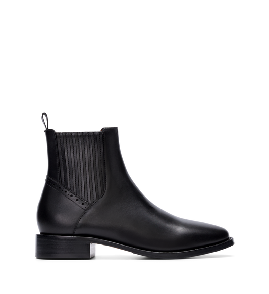 Black leather ankle boot with a rounded toe and low heel, featuring an inner side zip and elastic panels.