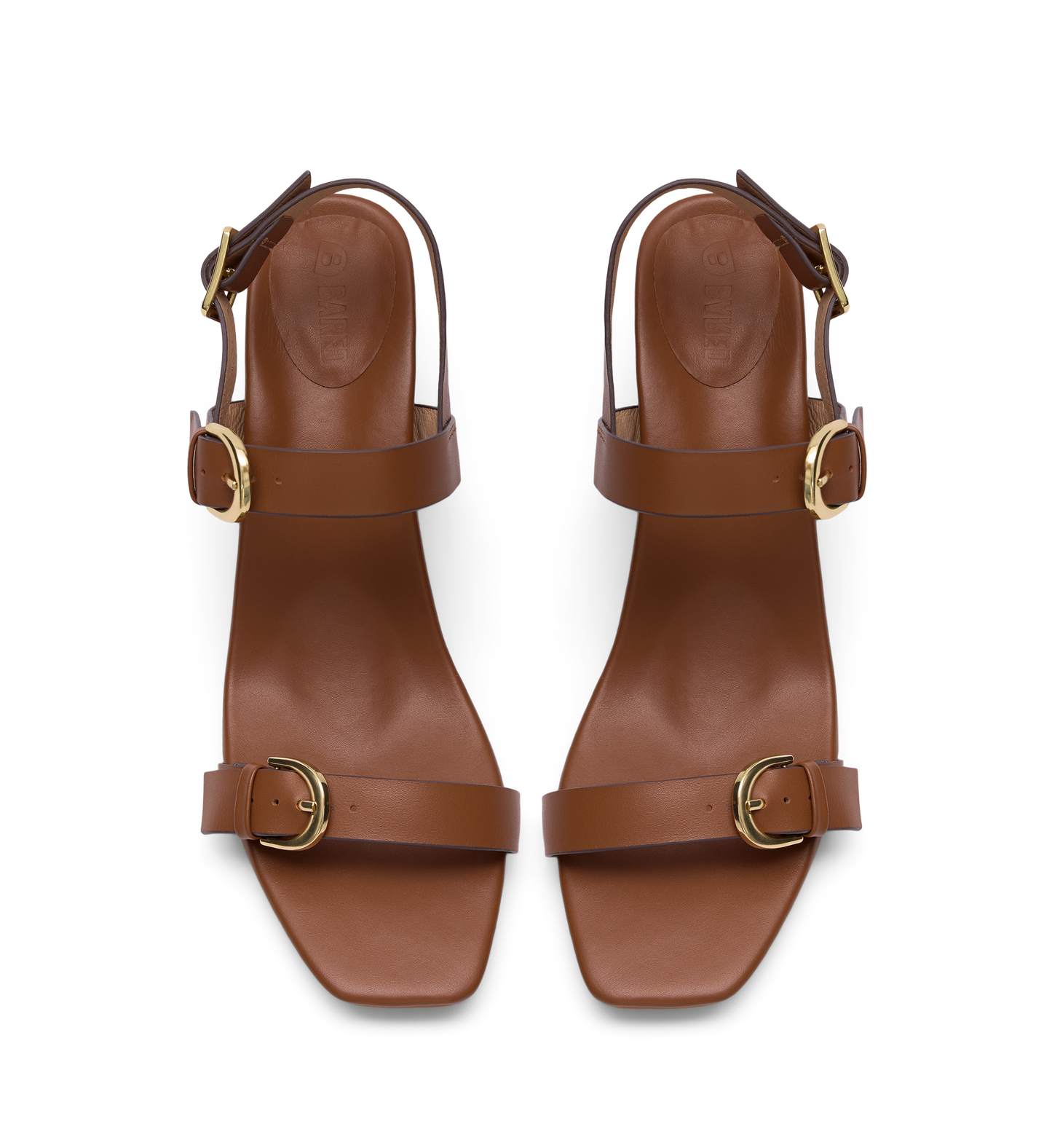 Pair of brown heels with gold buckles on a white background