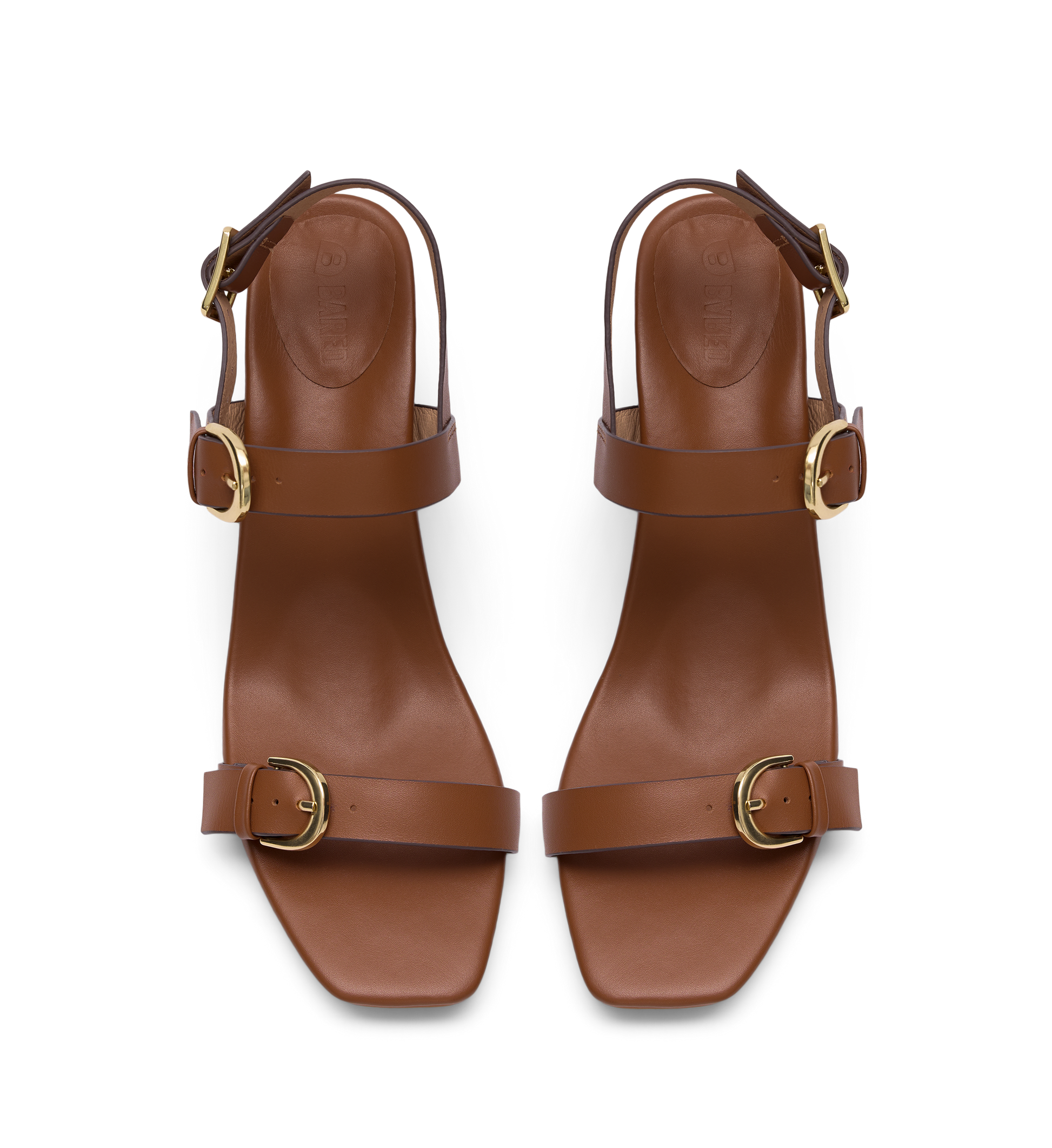 Pair of brown heels with gold buckles on a white background