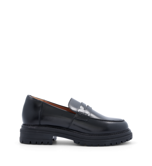 Black leather penny loafer with a chunky sole and rounded toe. The shoe is displayed against a plain background.