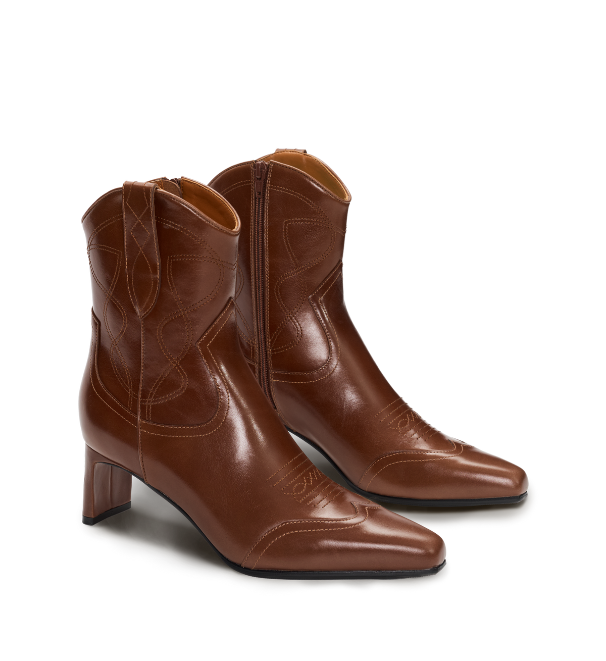 Pair of brown leather boots on a white background