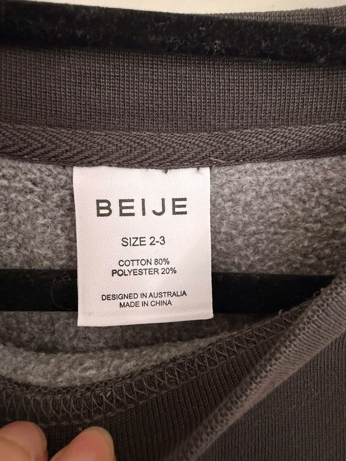 211077
