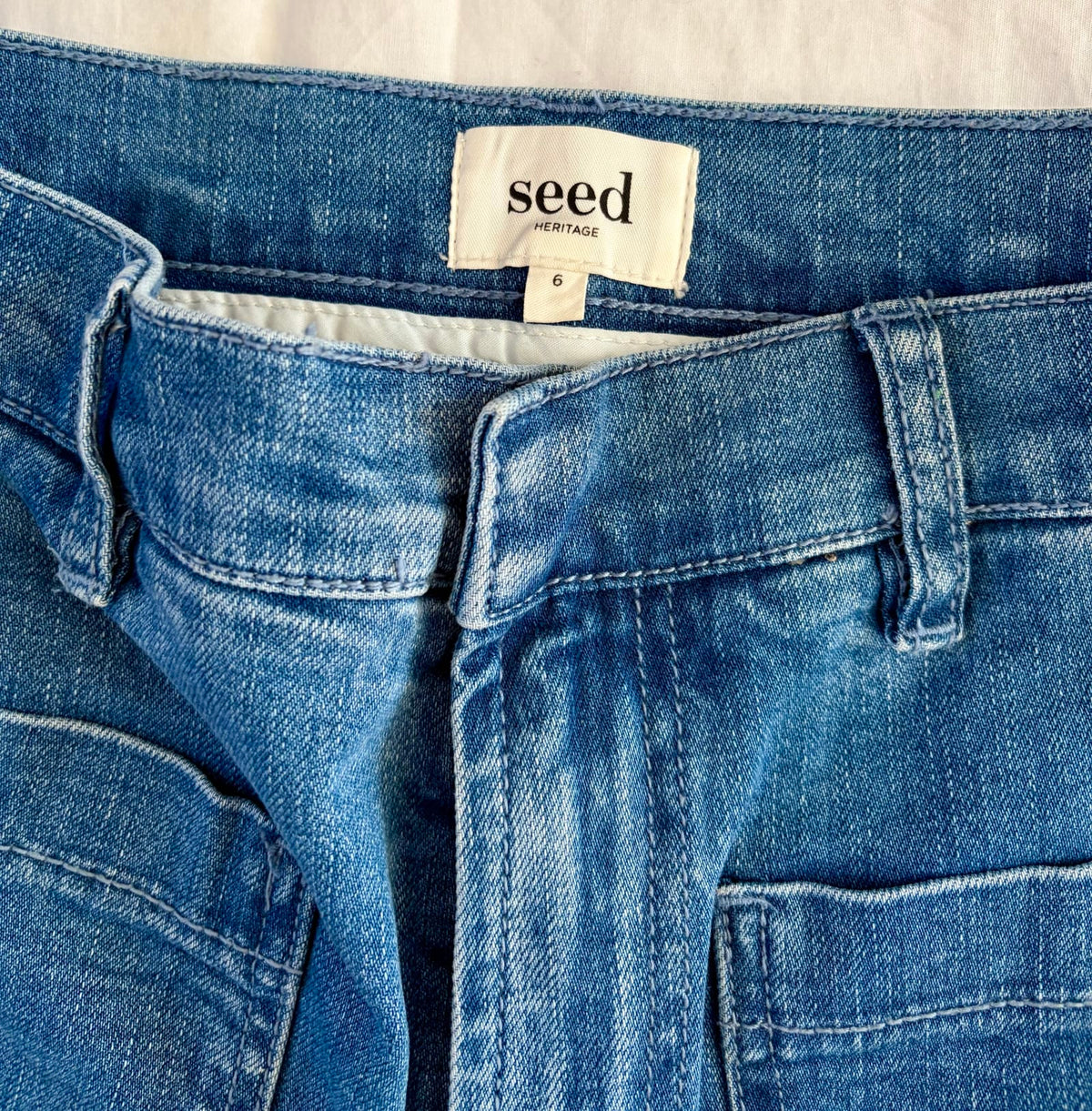208125